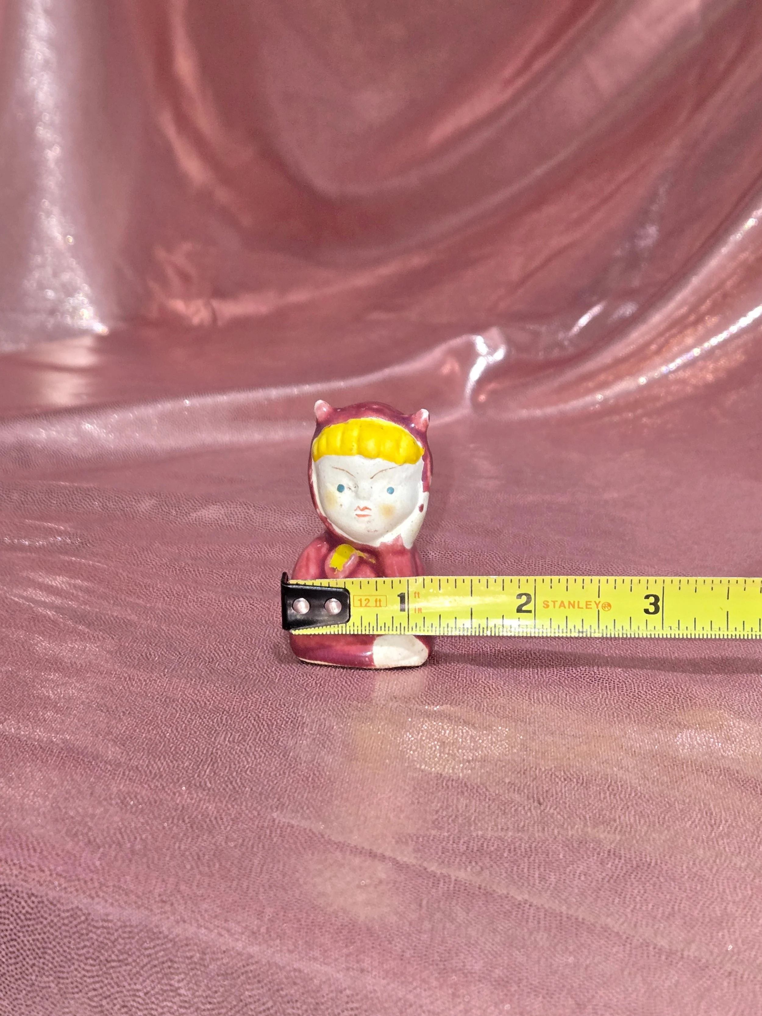 Close-up of painted details on pixie figurines