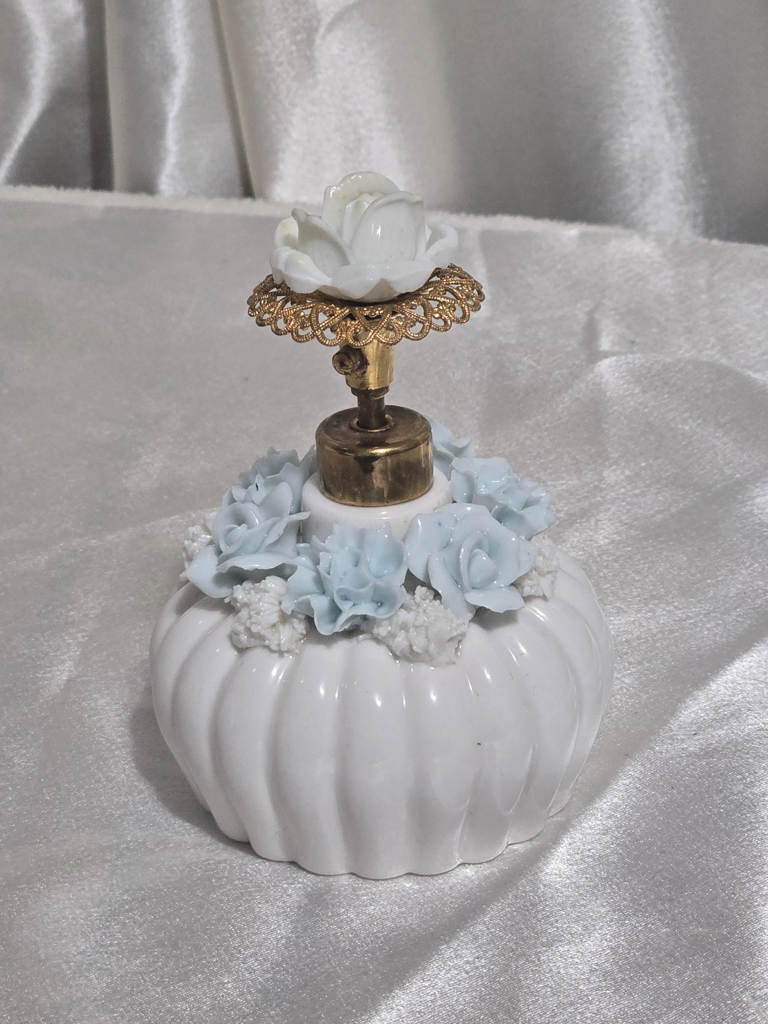 Blue floral porcelain perfume bottle close up