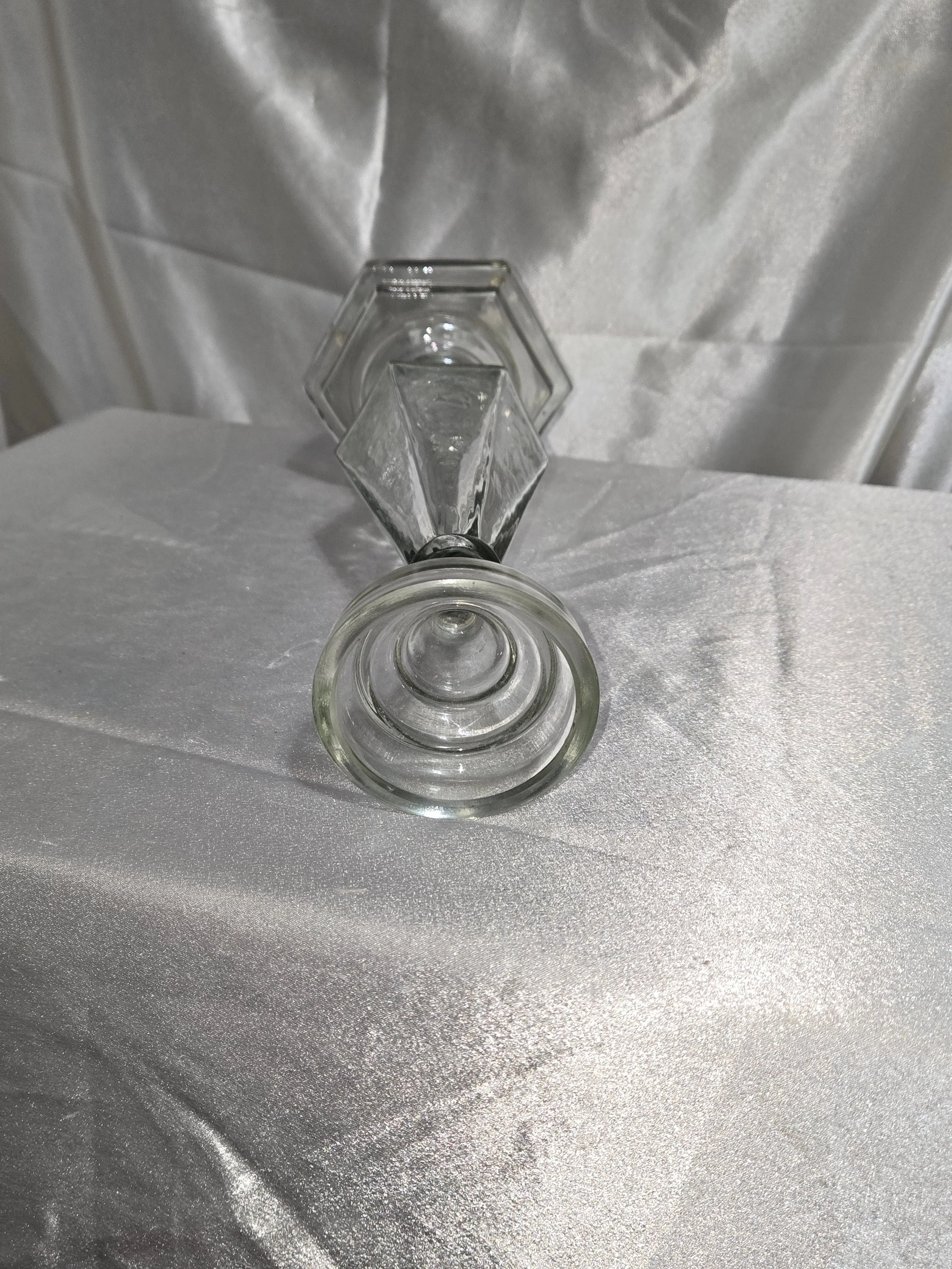 Tall clear glass candlestick with faceted column design