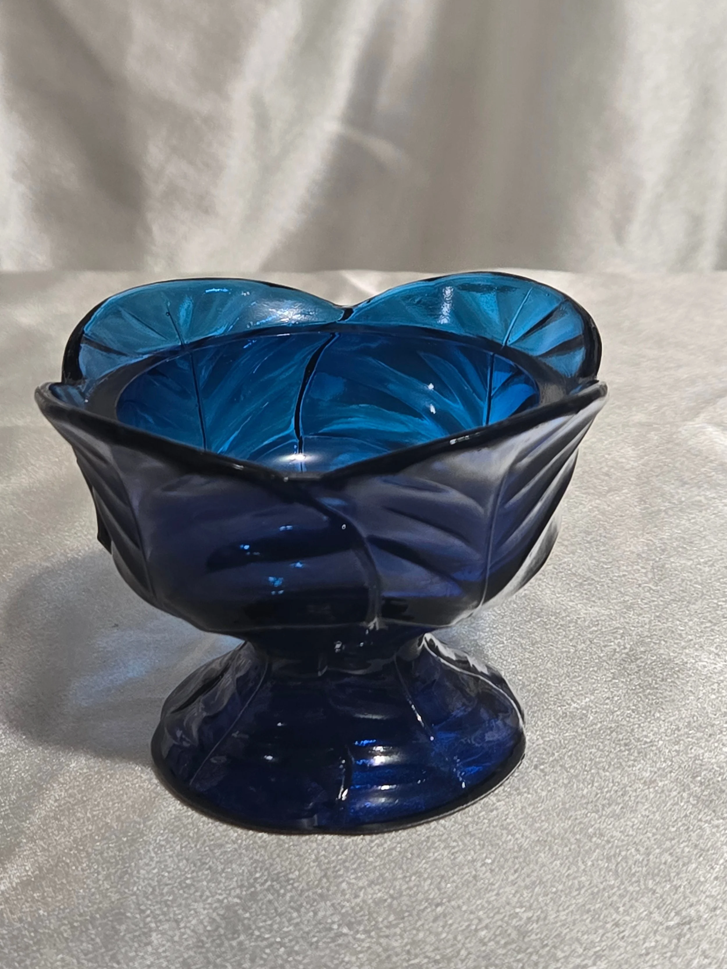 Viking Glass Glimmer Leaf fairy lamp base in charcoal blue pressed glass with leaf pattern and rounded form, mid-century vintage decorative piece.