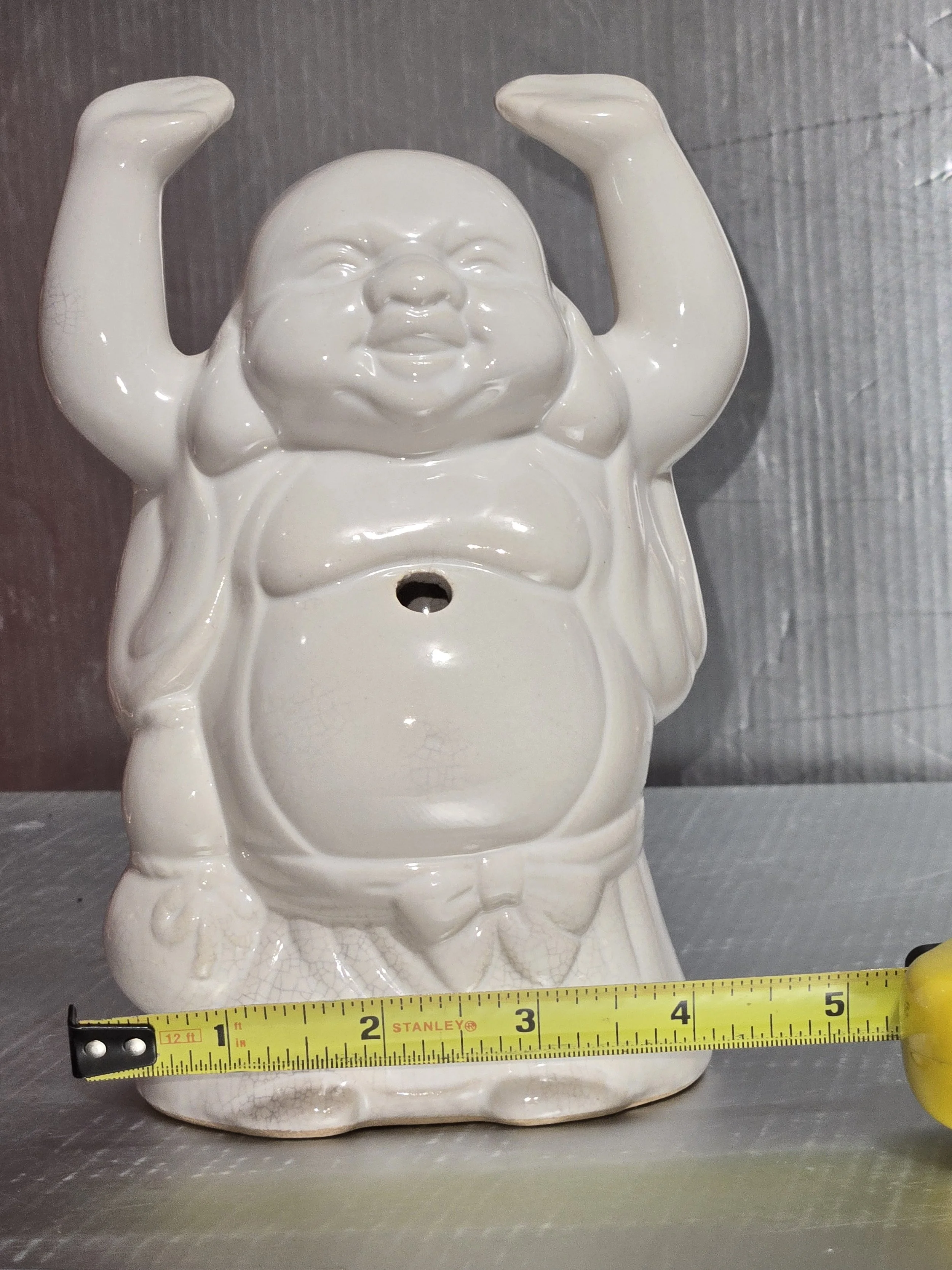 Vintage ceramic Happy Buddha figurine with raised arms