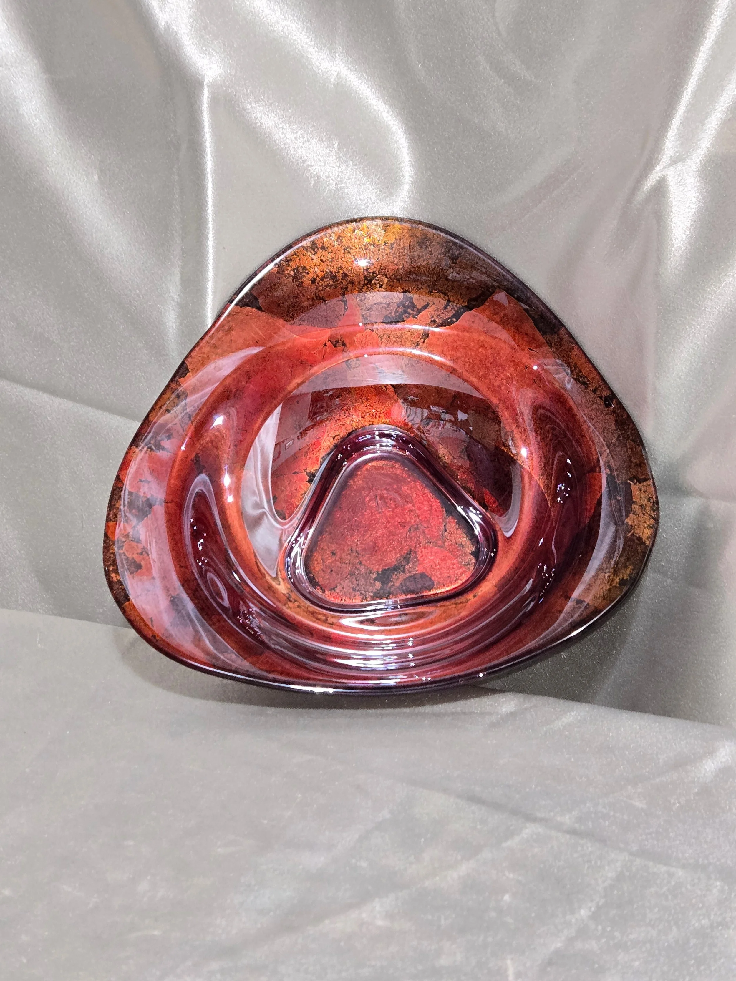Freeform Italian art glass bowl with ruby and amber tones