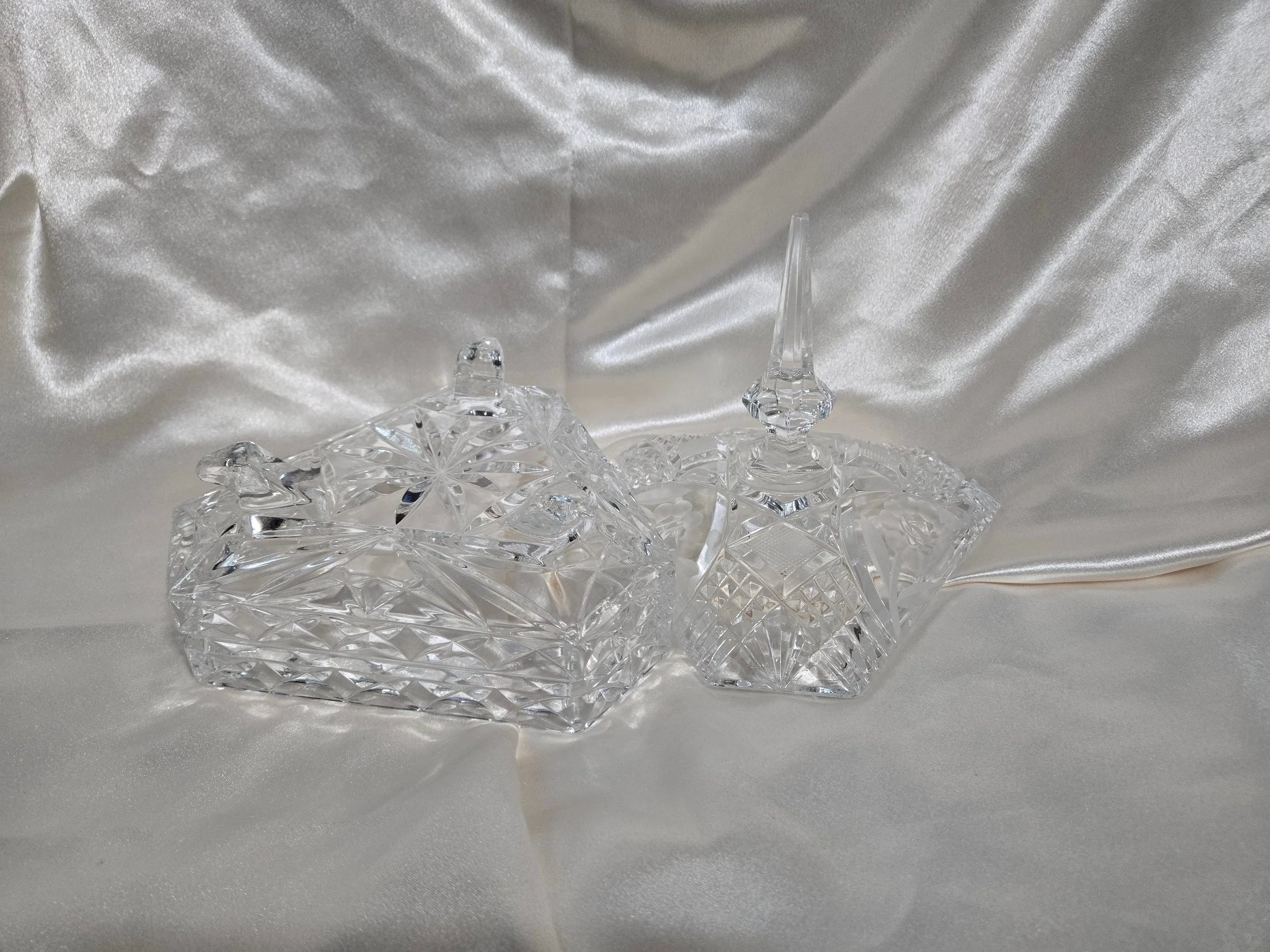 Clear glass lidded candy dish with geometric cut pattern