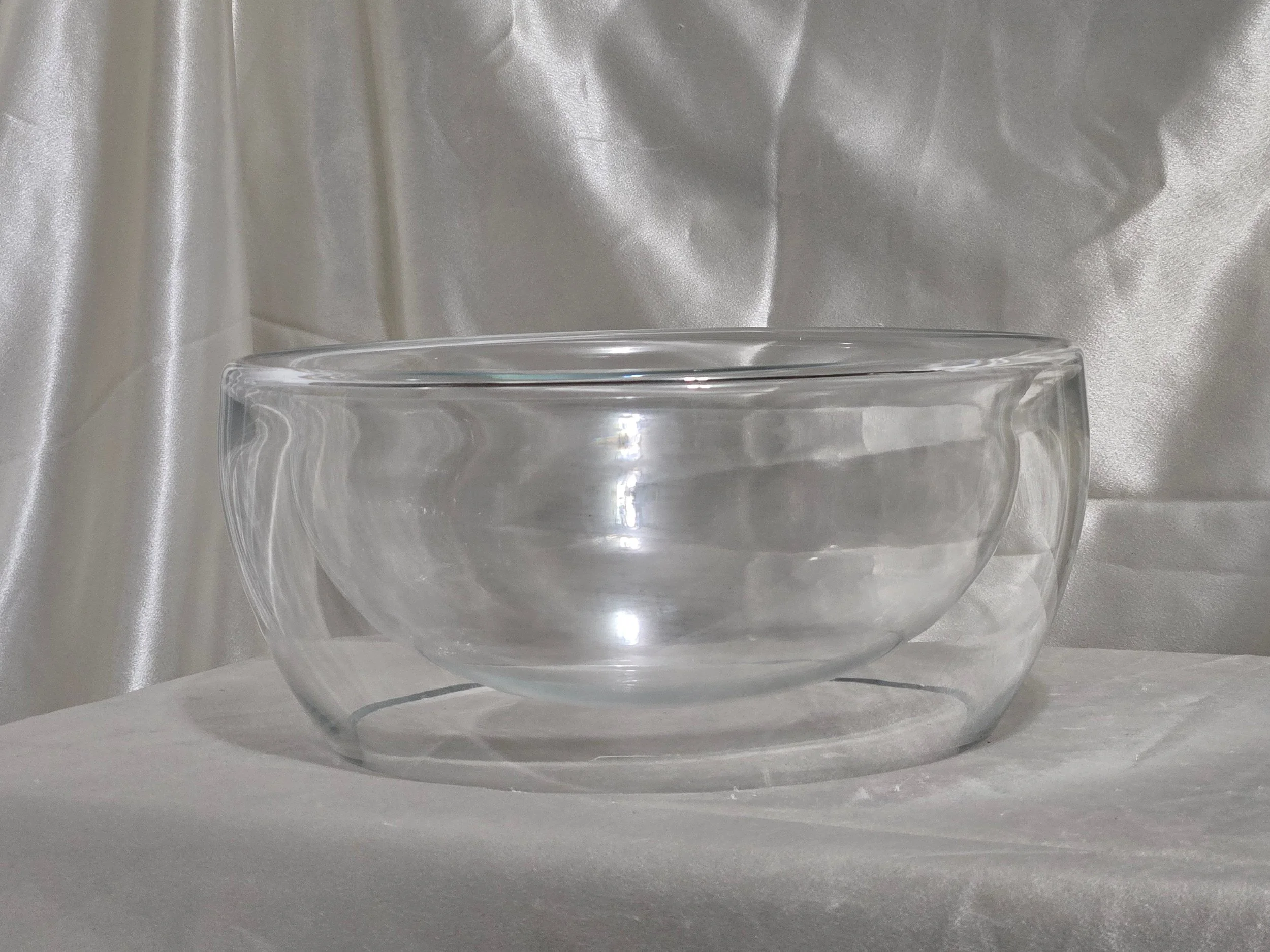 Clear glass double wall bowl displayed upright on neutral background