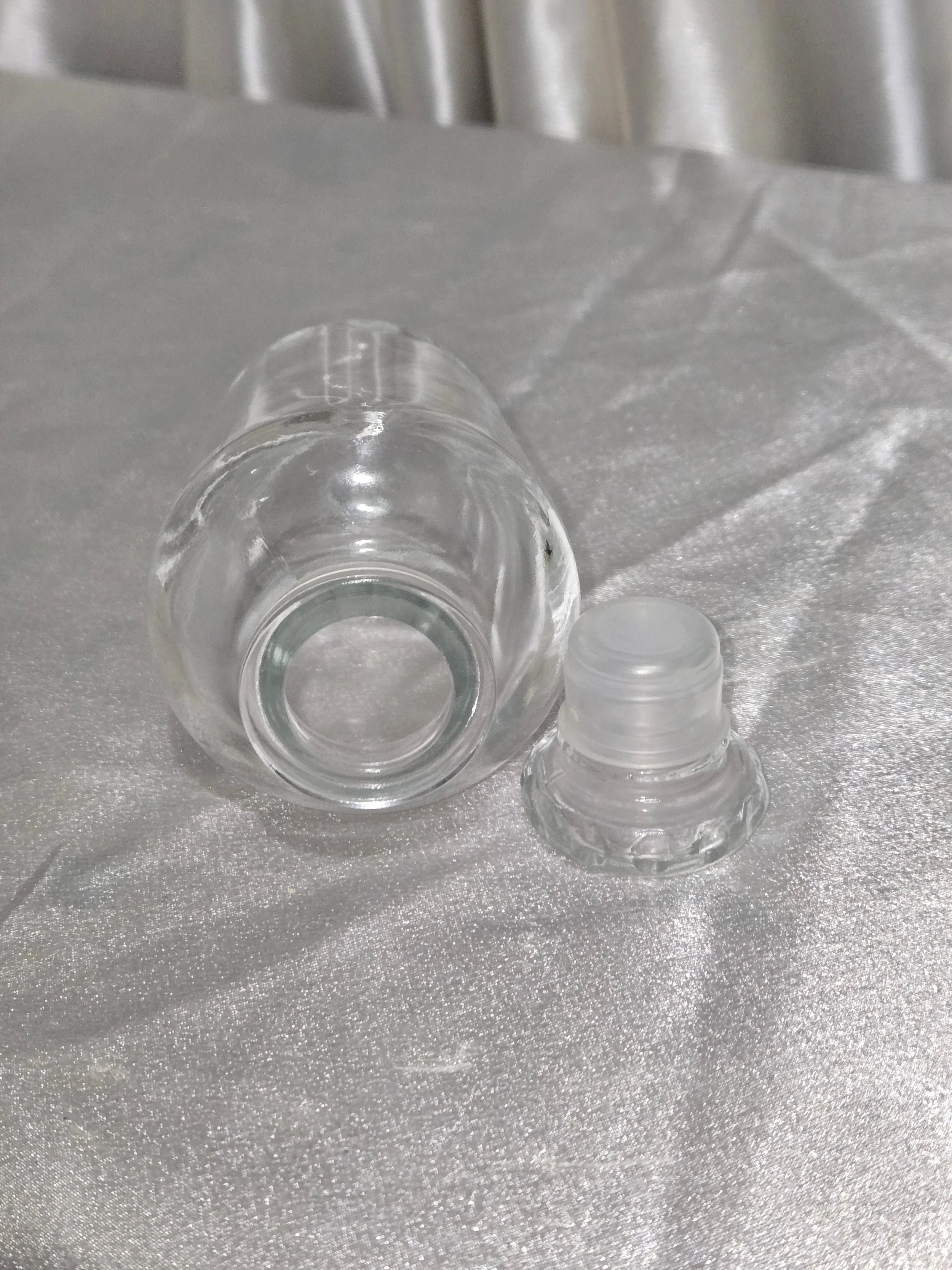 Close-up of glass stopper and bottle neck