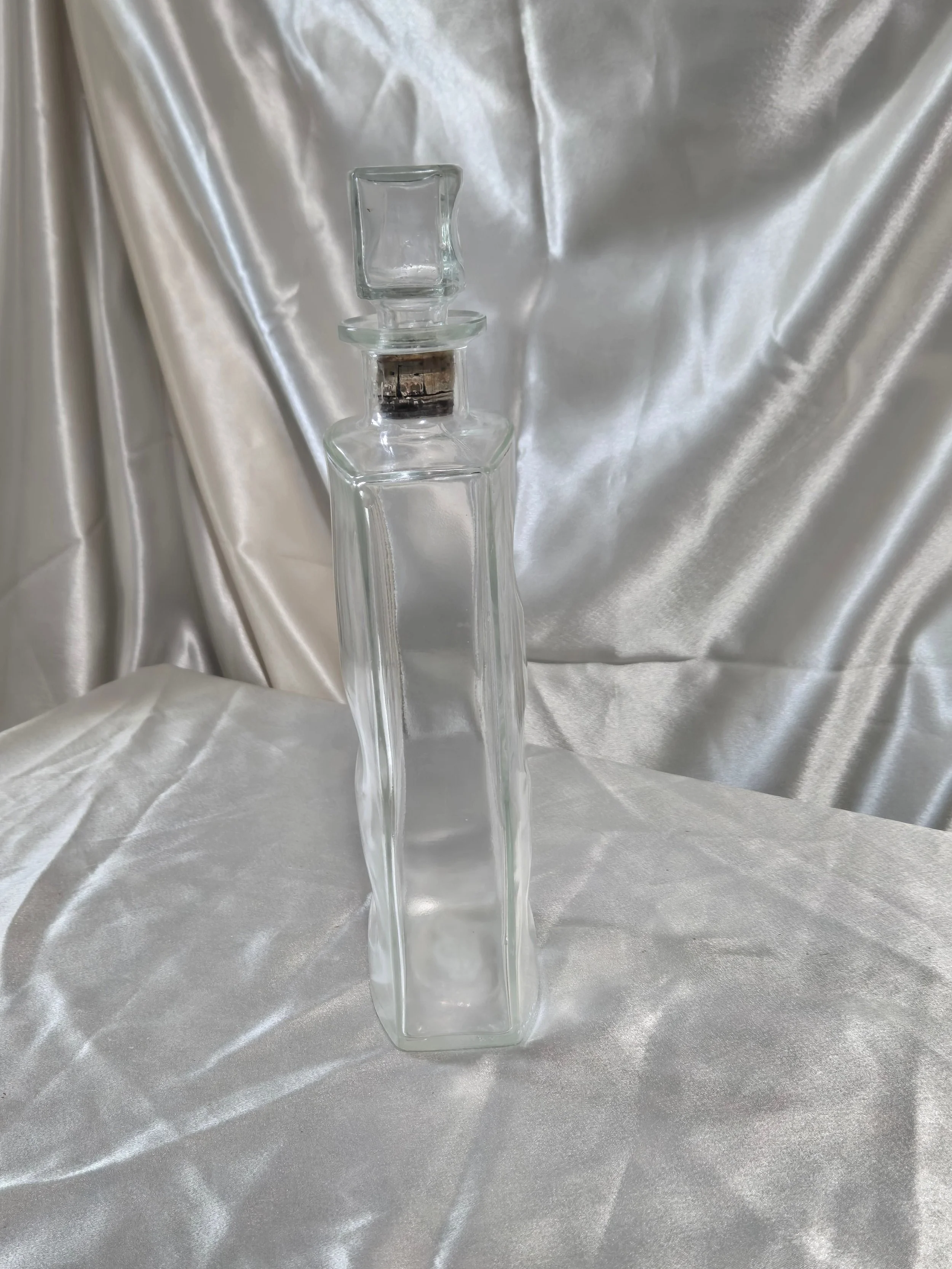 IW Harper Kentucky Bourbon decanter standing upright on silver backdrop