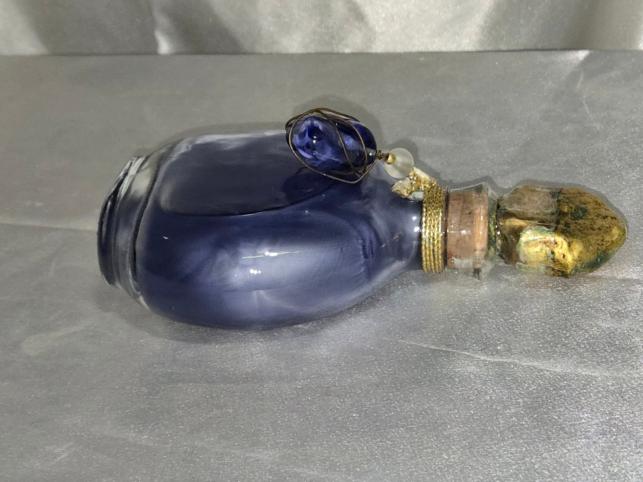 Vintage Lalique style perfume bottle side view