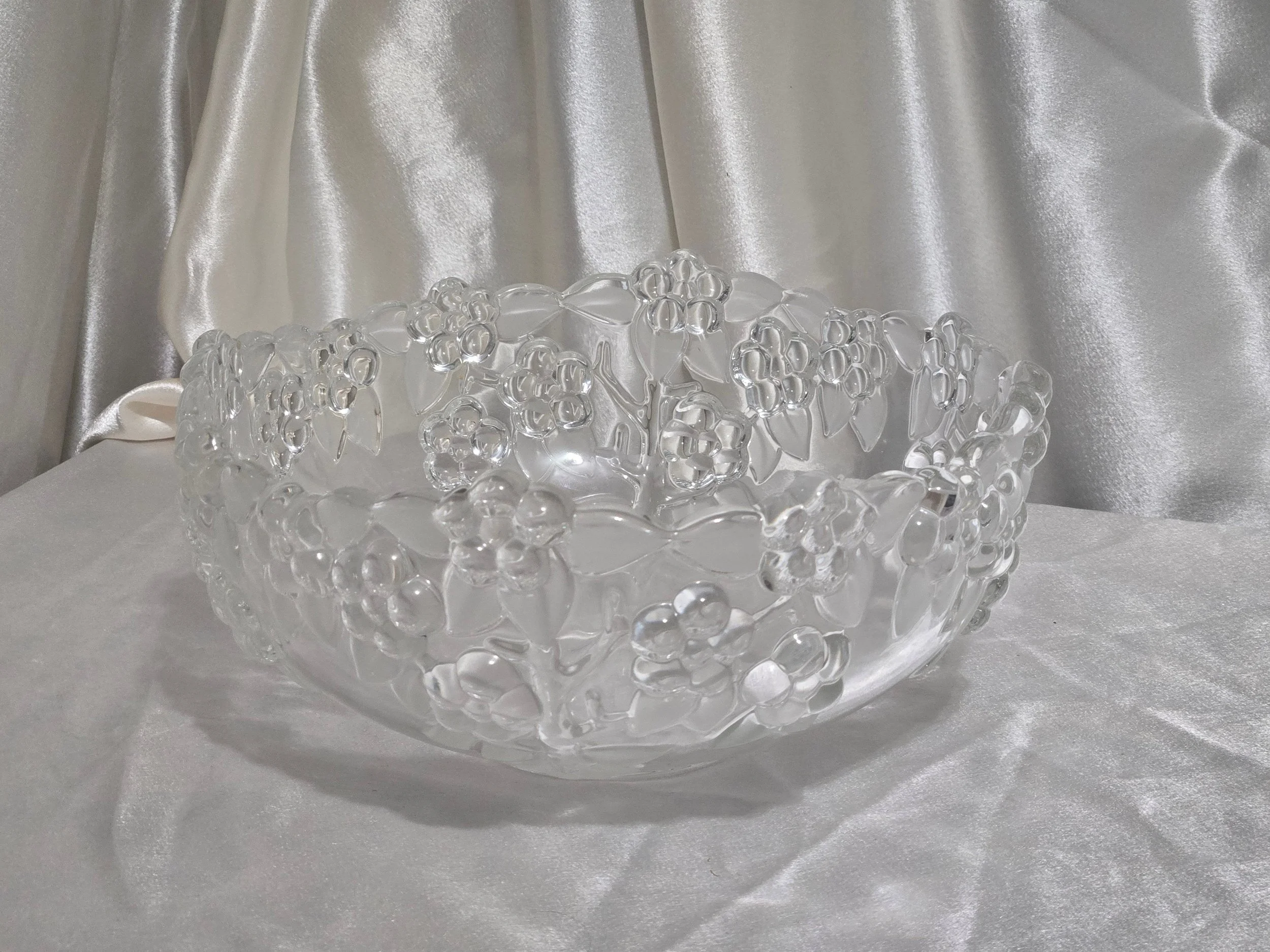 Clear pressed glass bowl with raised grape cluster design