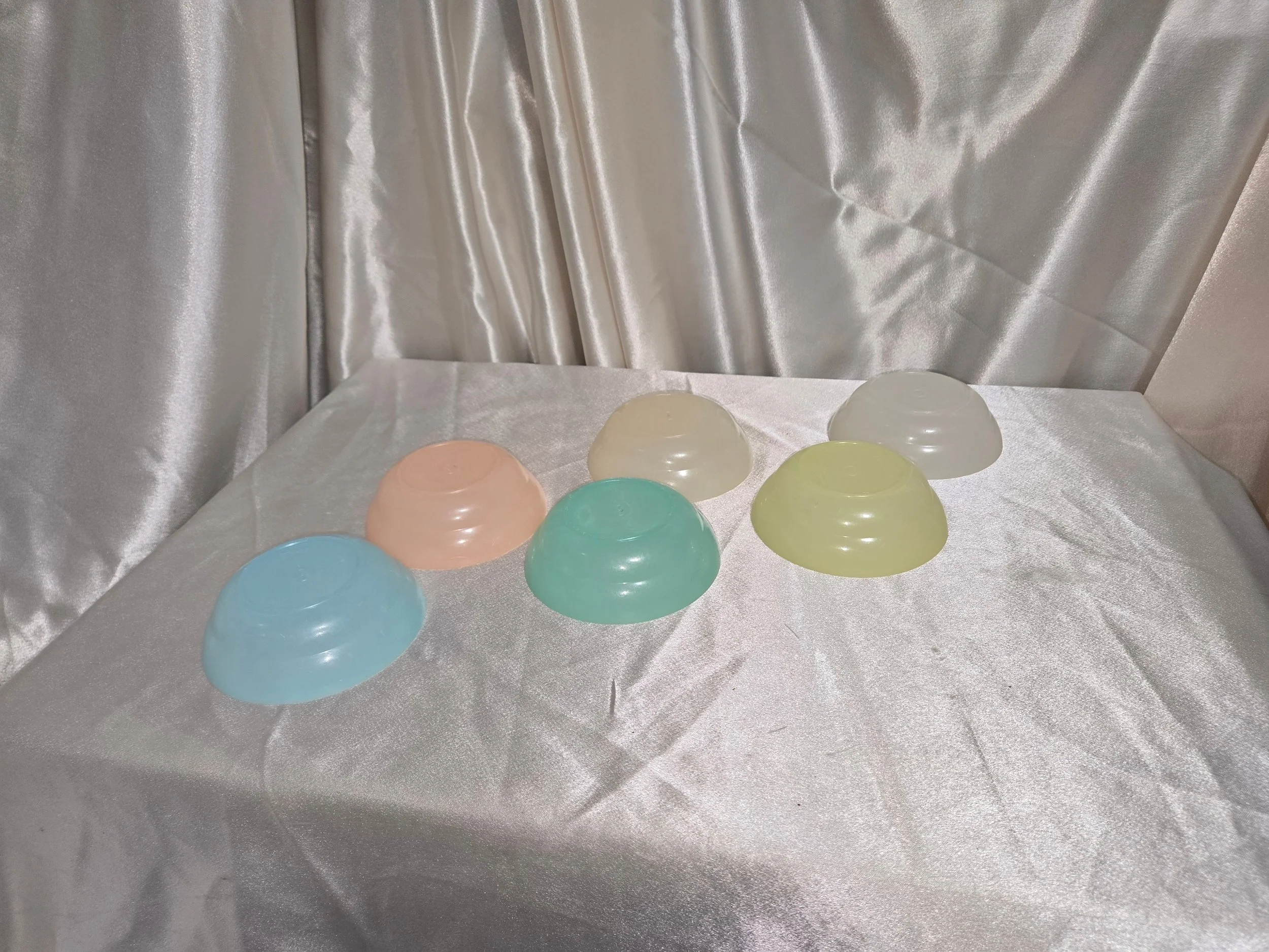Vintage pastel Tupperware mini bowls set arranged on table