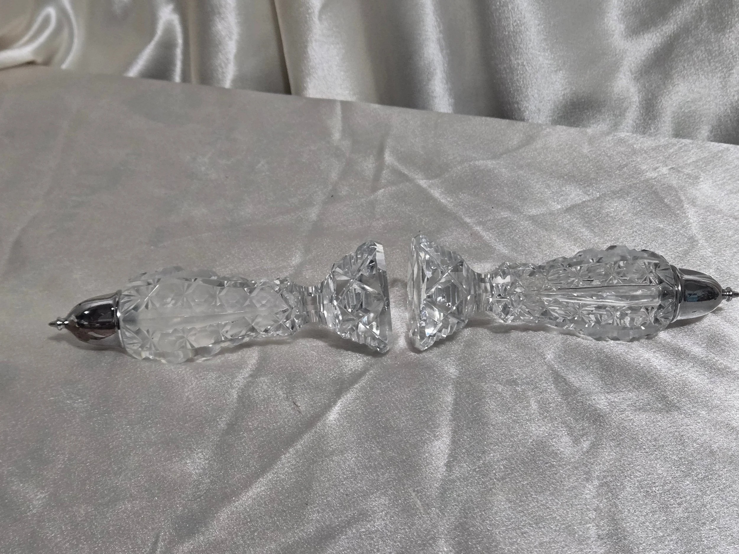 ide view of faceted crystal shaker showing cut glass pattern and metal lid