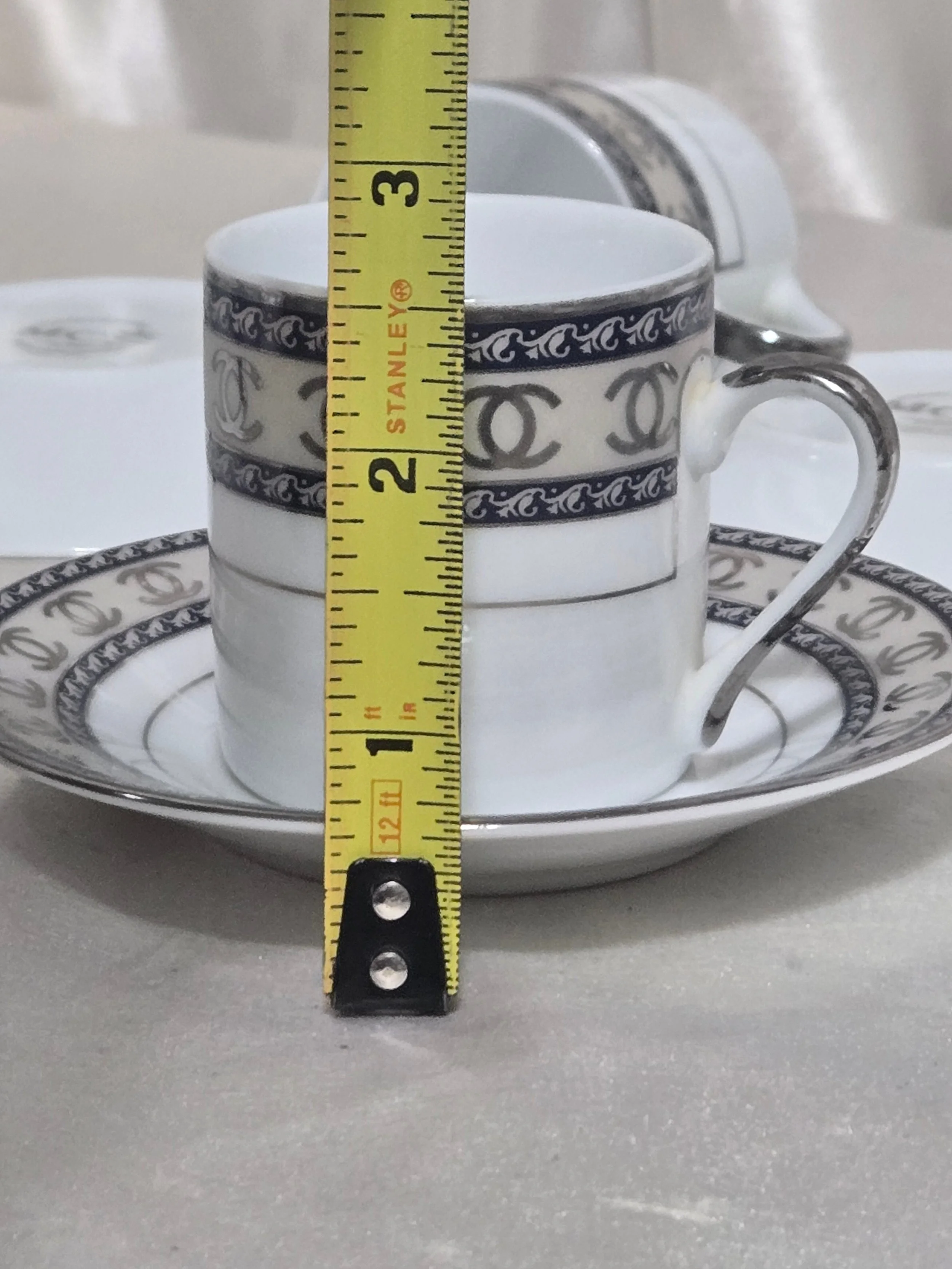 Measurements of the height of cup and saucer