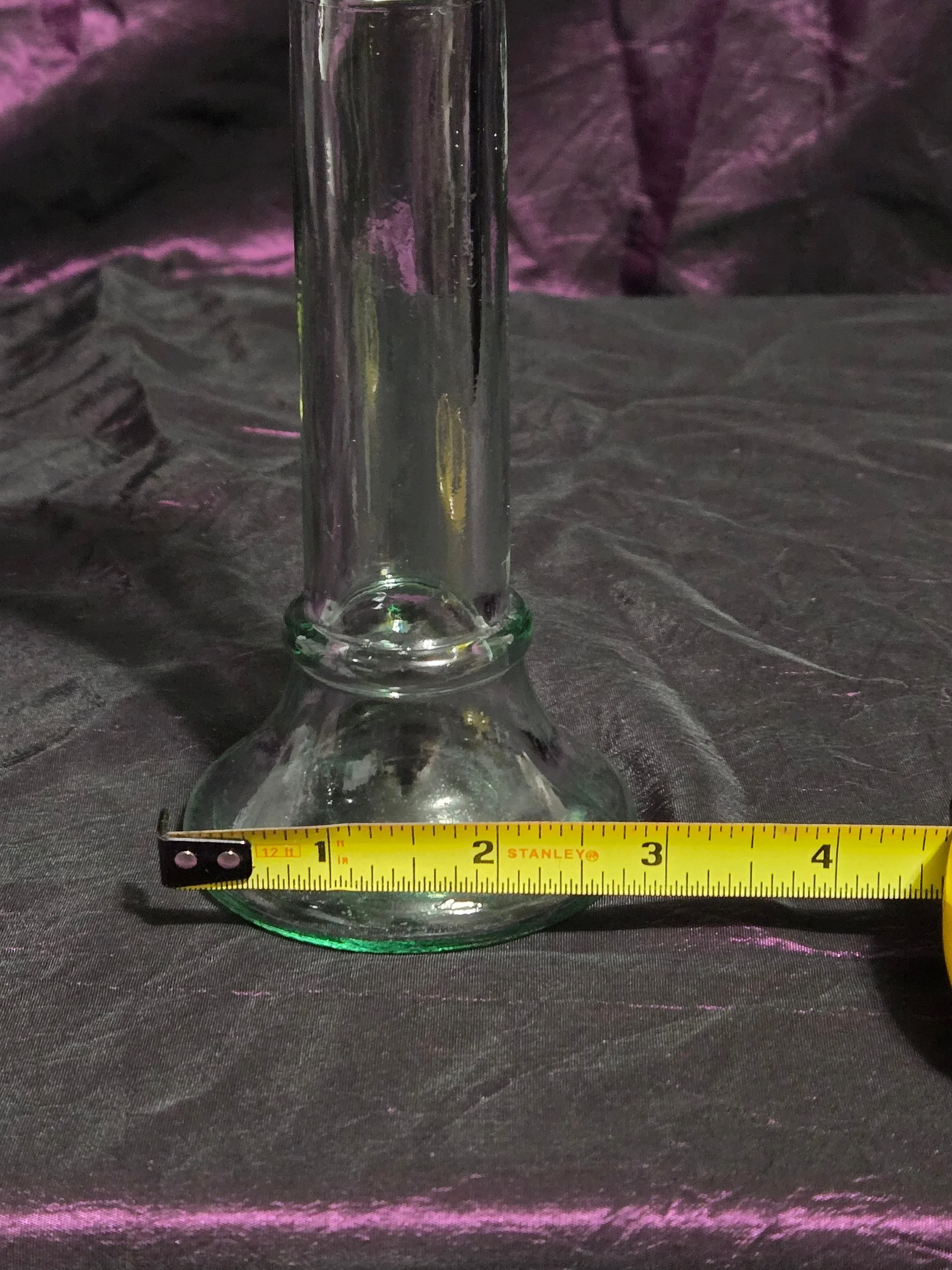 Clear glass candlestick holder with faint green tint, elegant fluted base, and timeless vintage style.