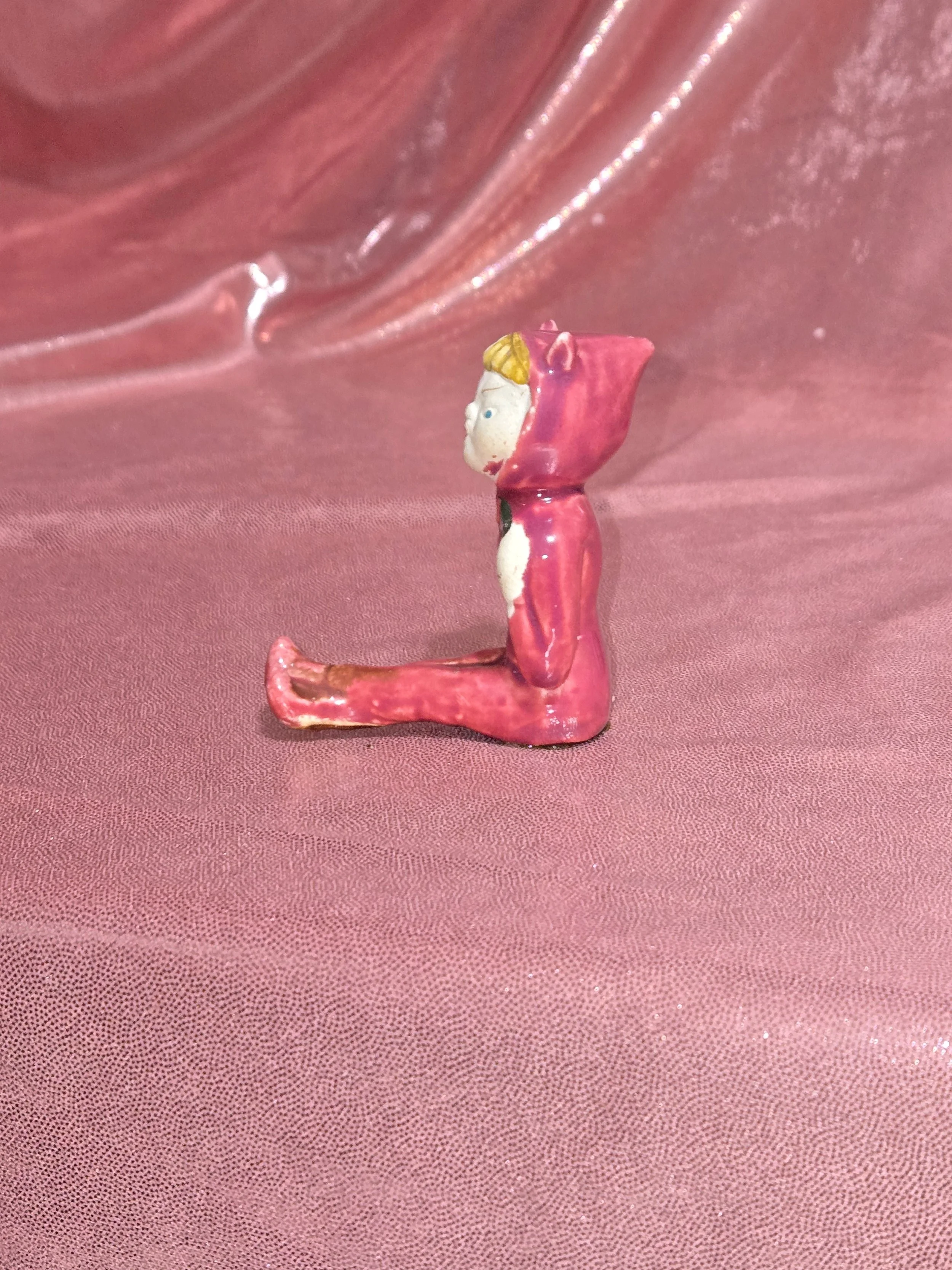 Side view of vintage devil figurines