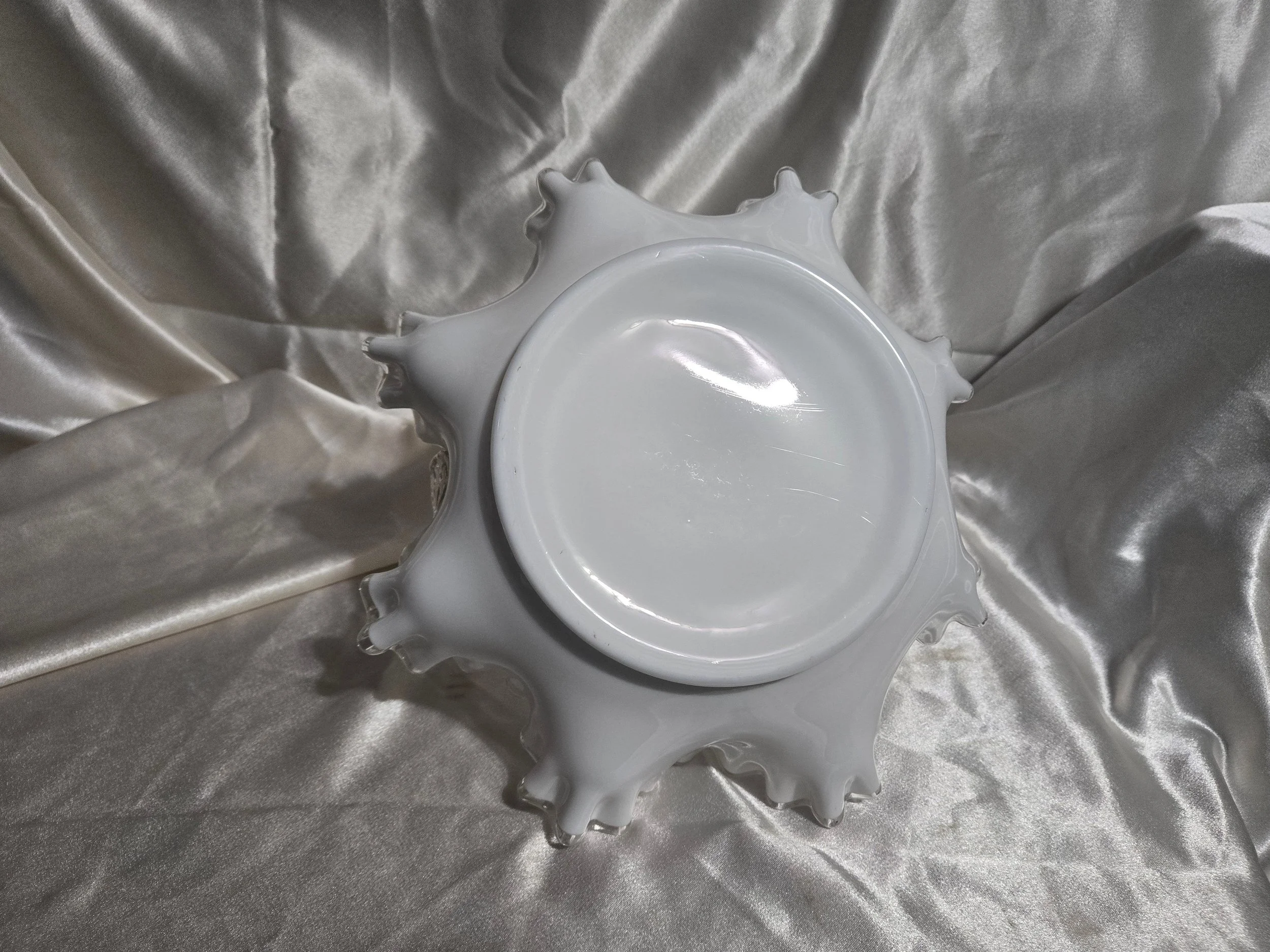 Vintage Fenton-style clear glass bowl featuring etched floral pattern and crown motif with visible handle repair.