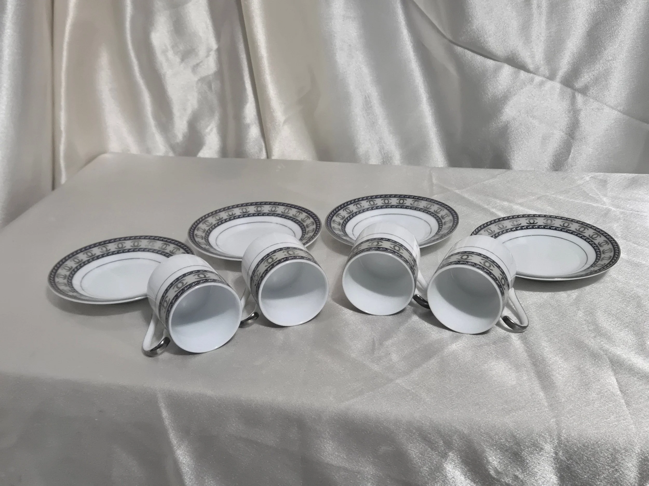Set of 4 Mc Bavaria Espresso Demitasse Cups and Saucers with cups laid to show you the inside of cups