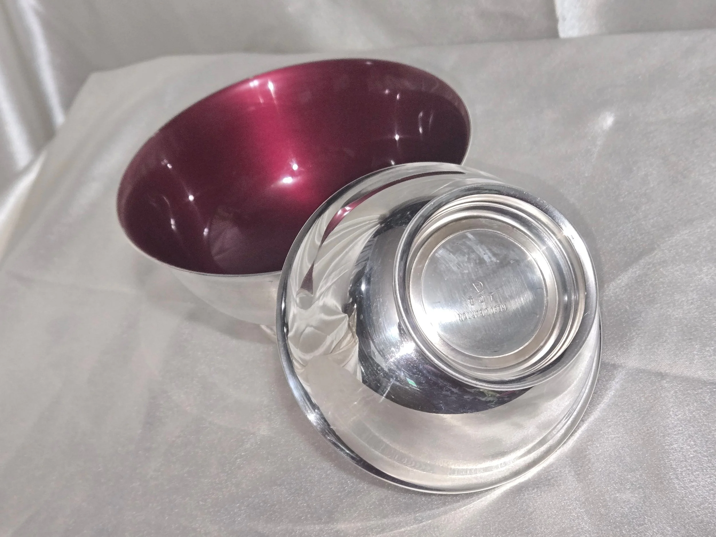 Pair of Paul Revere style silver pedestal bowls on display