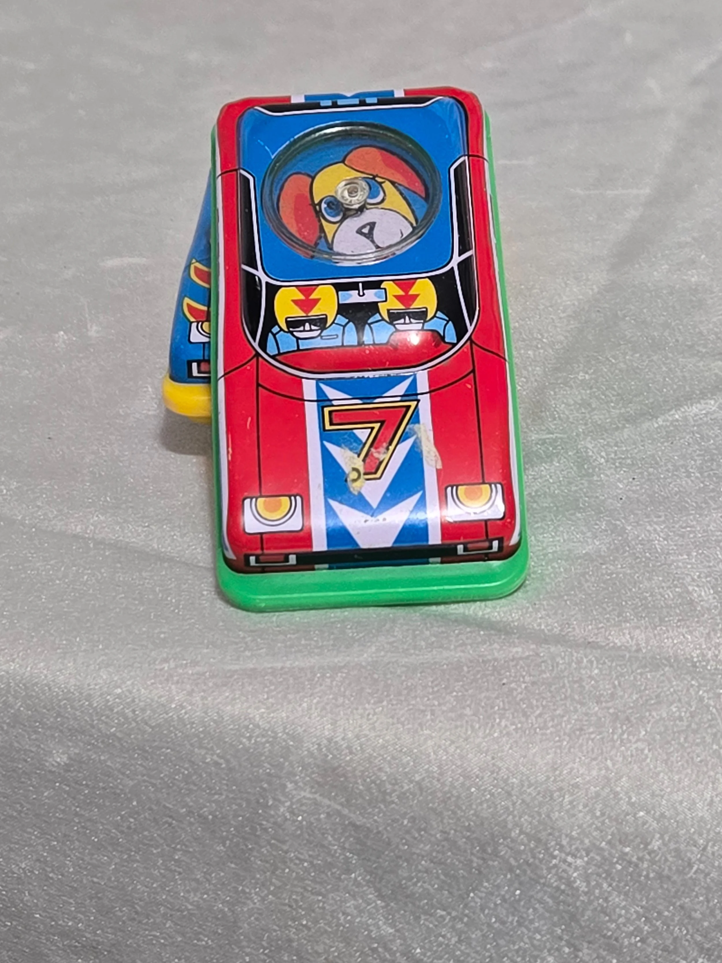 Colorful vintage tin toy cars top view