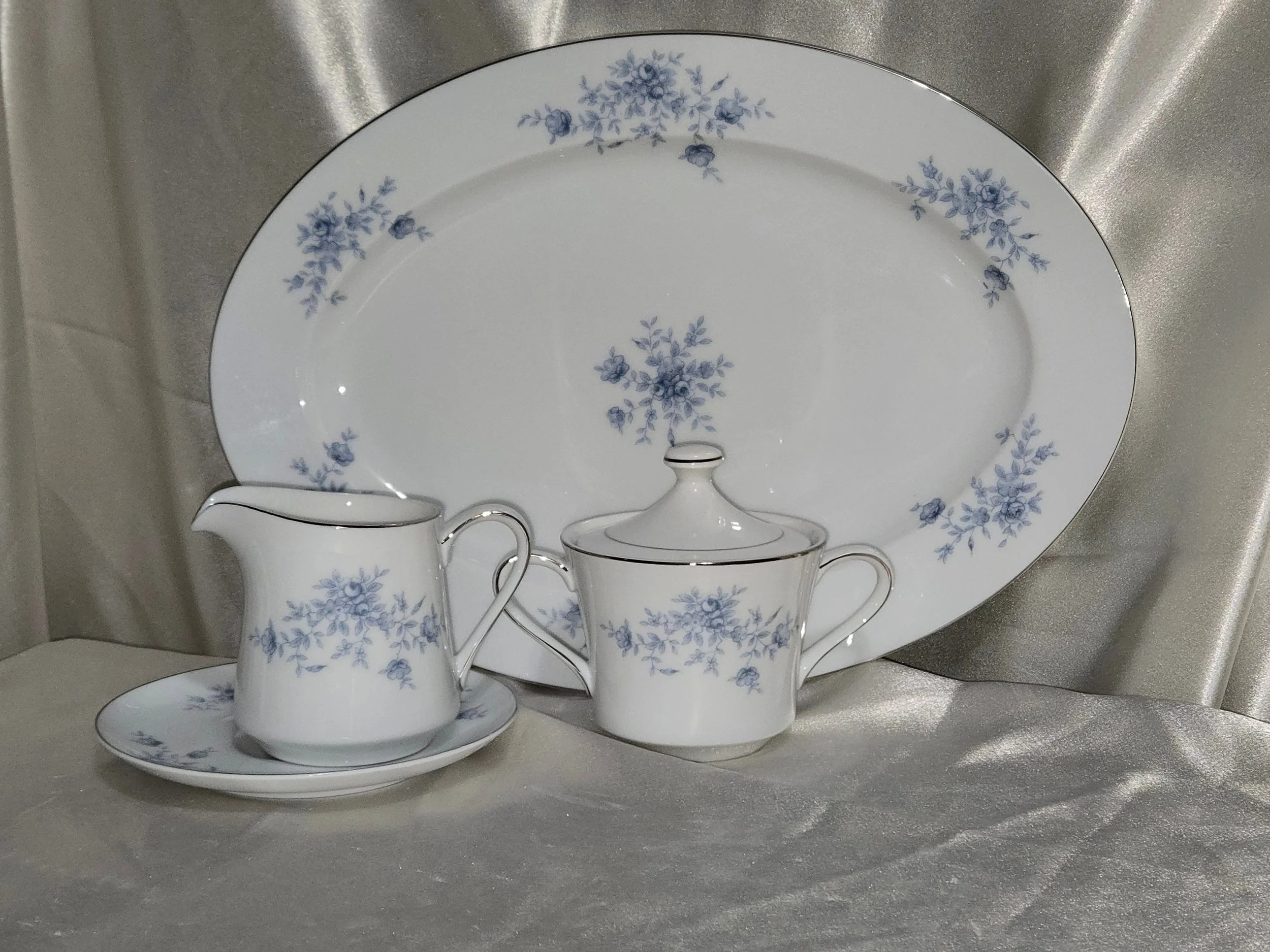 Vintage blue floral China serving pieces displayed