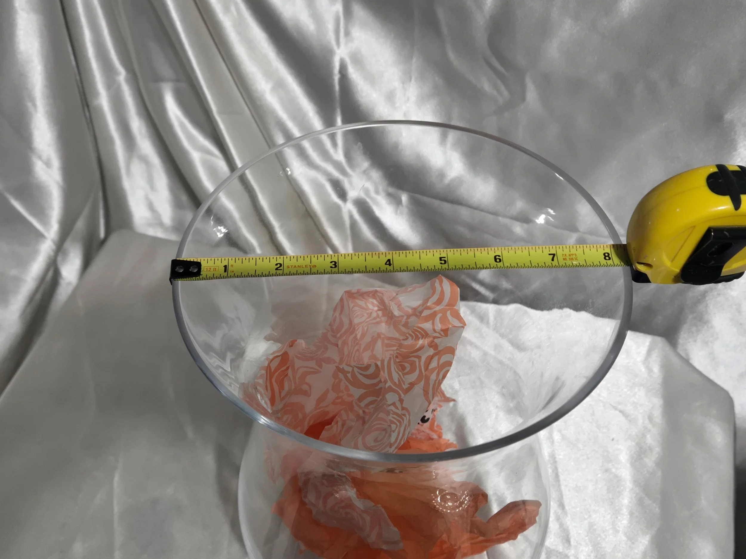 “Top view of clear glass hurricane vase showing wide flared opening and smooth rim