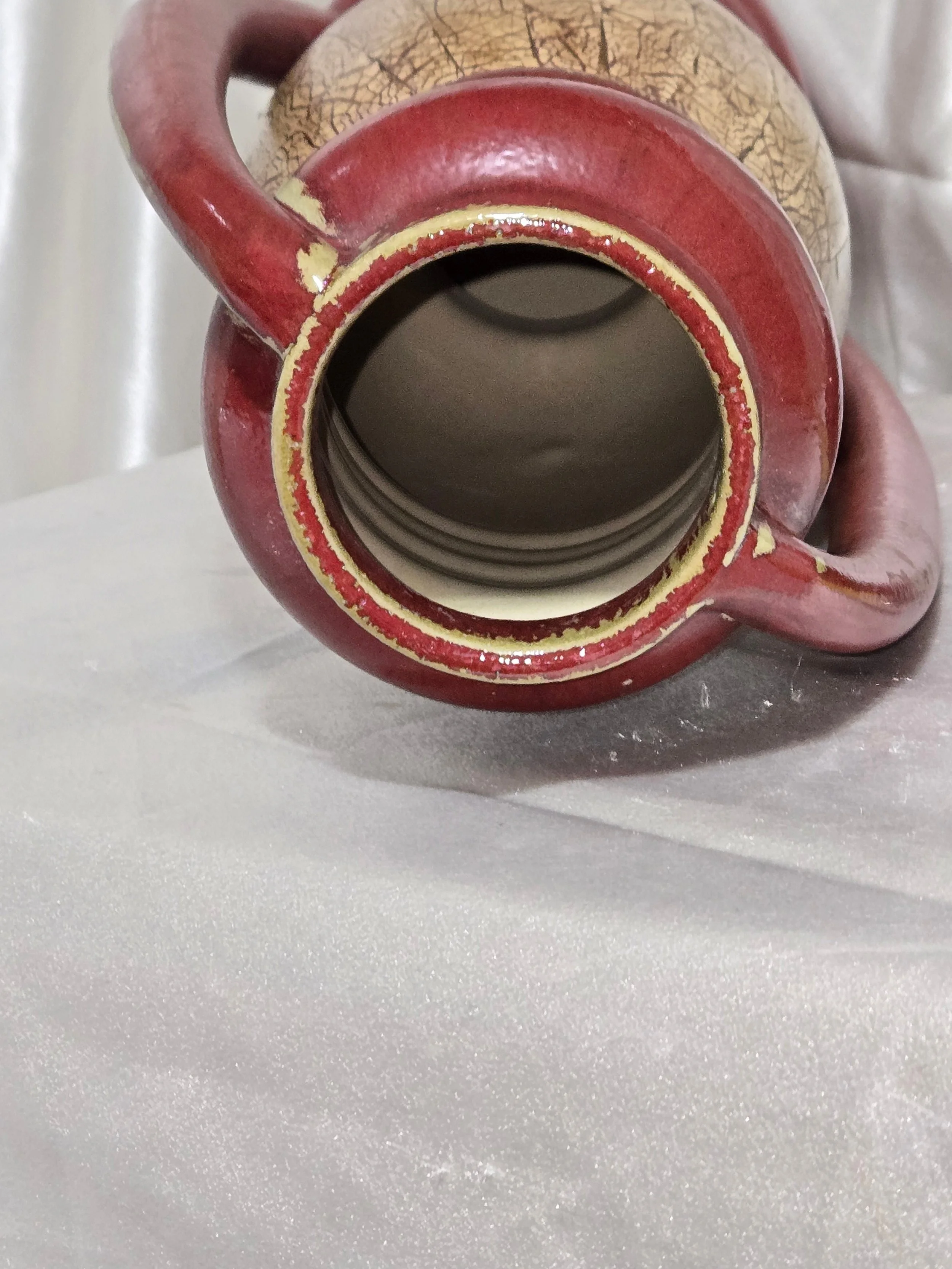 Vintage Grecian-style ceramic urn vase with crackle glaze finish and twin handles displayed on neutral backdrop.