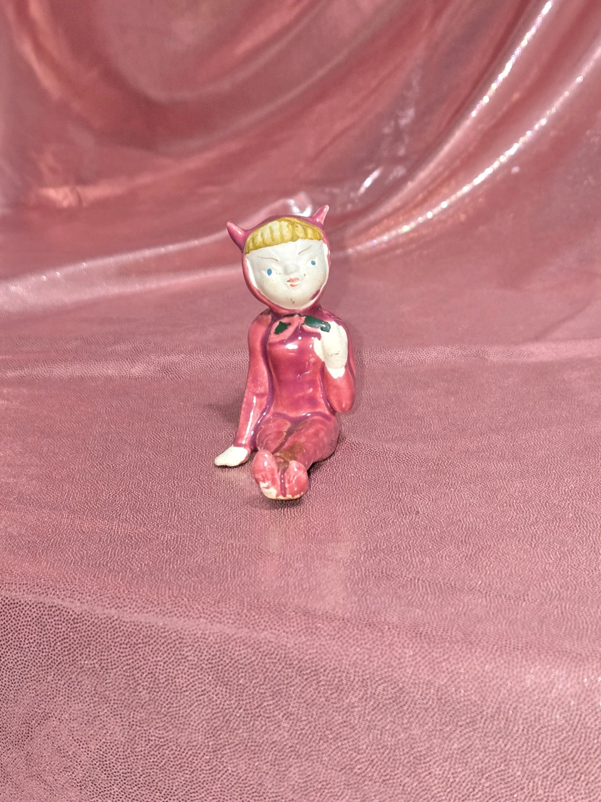 Close-up of painted details on pixie figurines