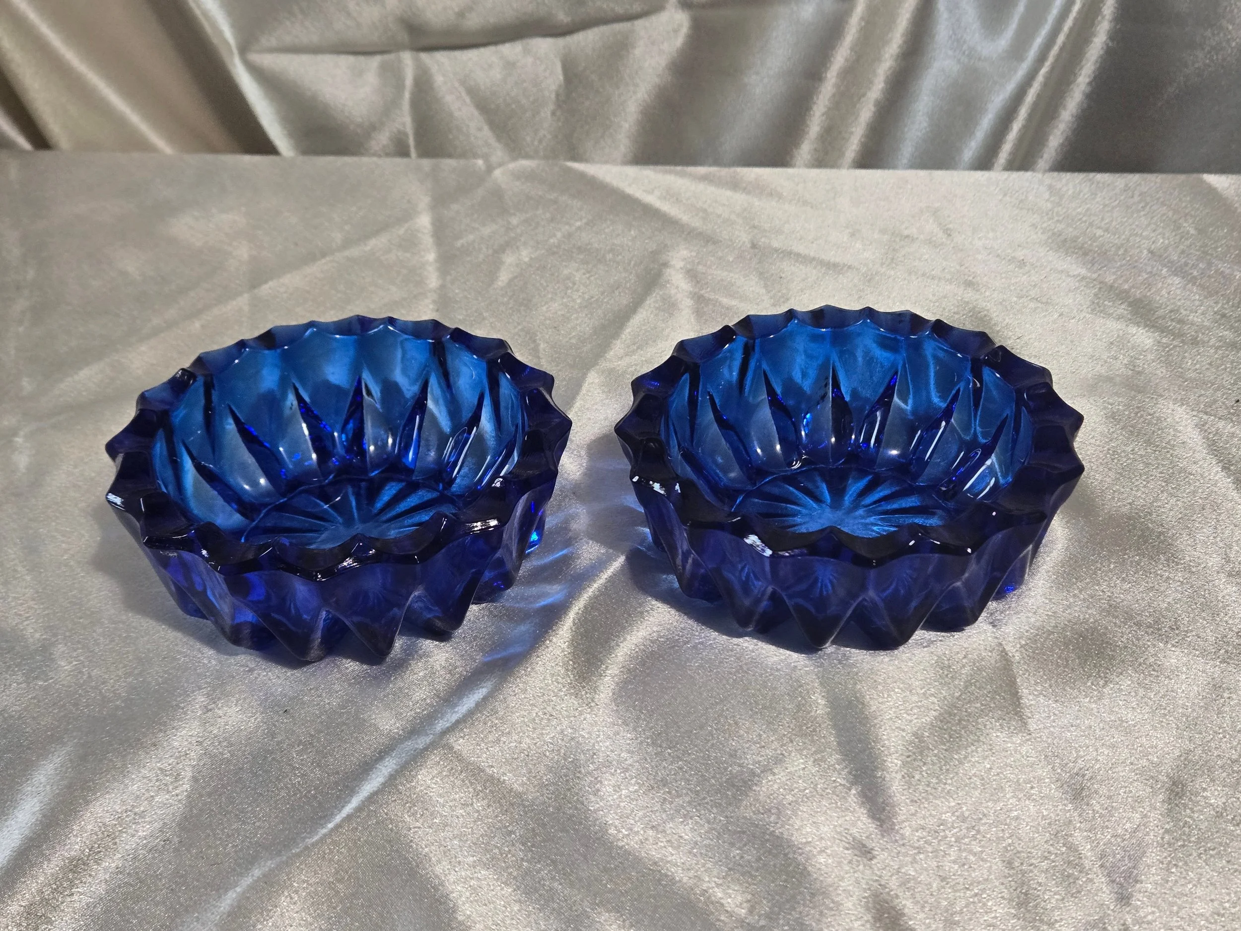 Pair of cobalt blue glass bowls side-by-side