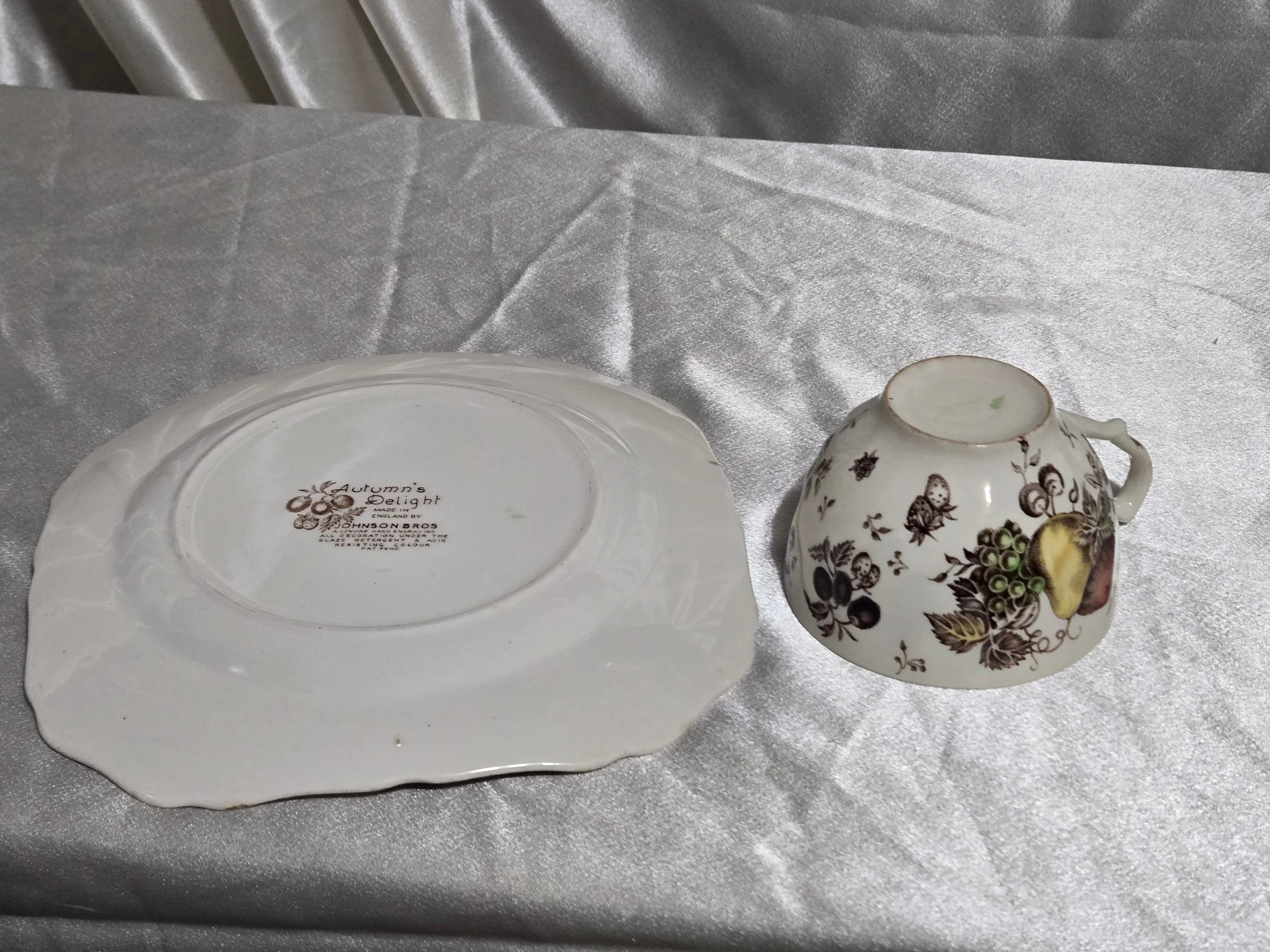 Vintage Autumn’s Delight floral dish with warm orange and gold tones, embossed leaf pattern, and scalloped edges on display.