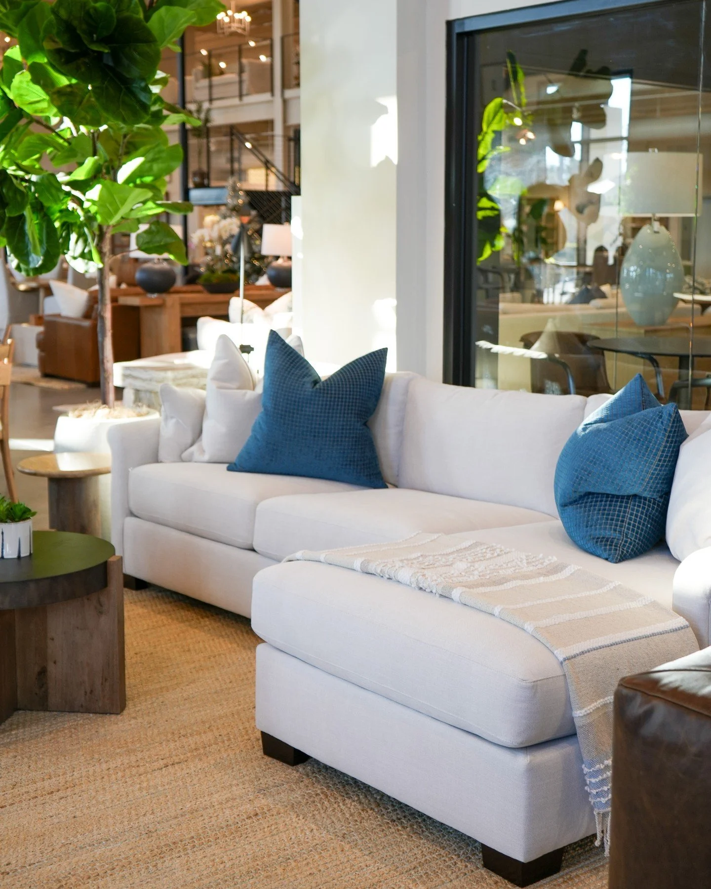 Holiday hosting starts here. Cozy blues, creamy neutrals, and warm wood tones wrapped around a sectional made for gathering.