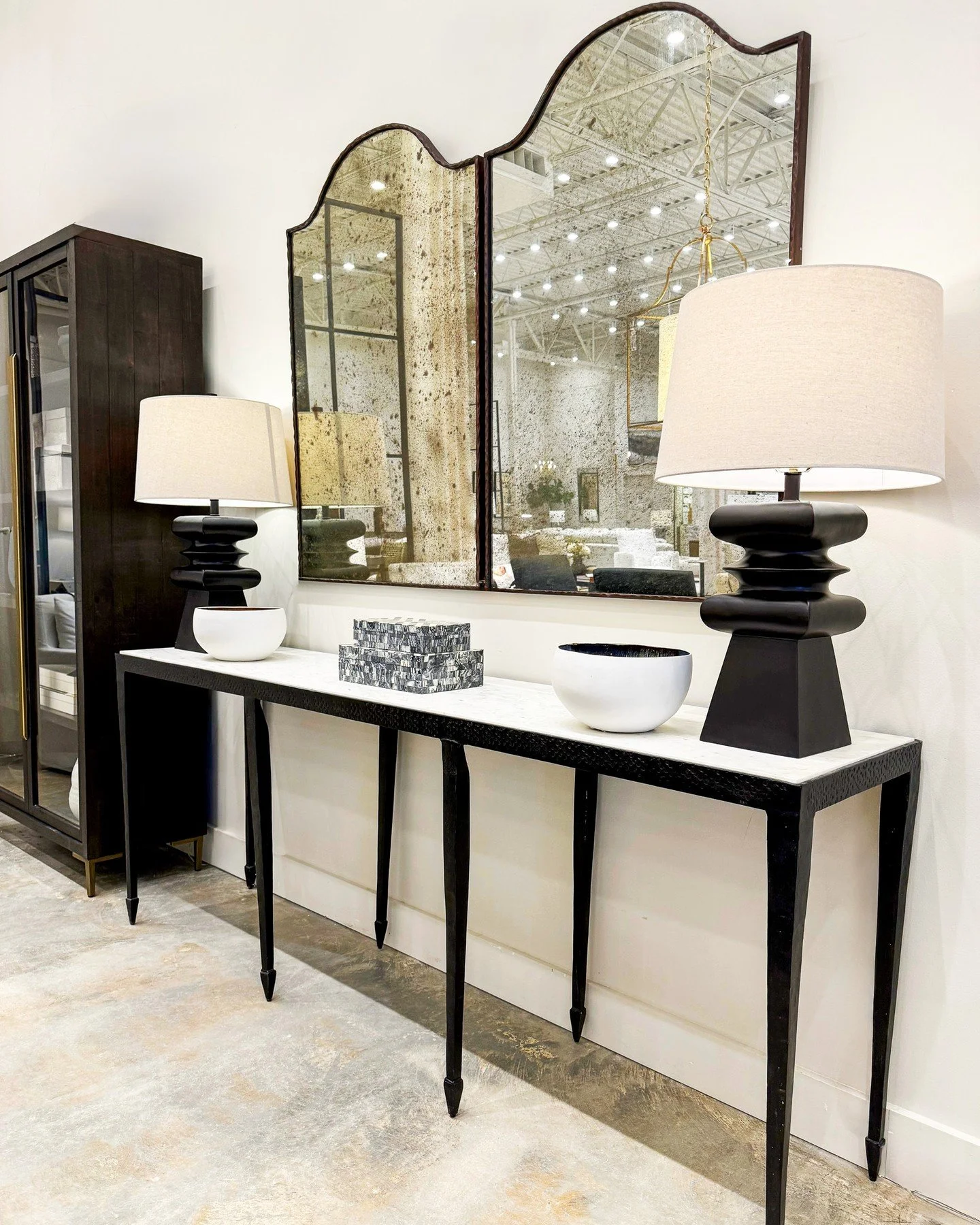 Neutral, but never boring. This monochromatic console setting from our Spanish Fort showroom is all about balance, texture, and restraint.