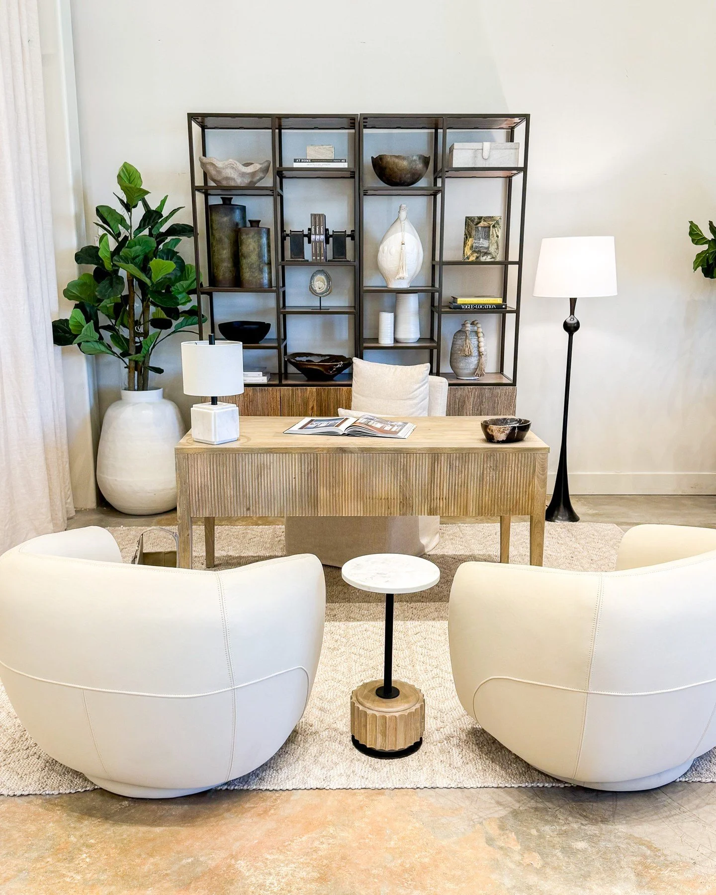 A workspace that feels as good as it looks.

Sculptural lounge chairs, warm wood tones, and curated accents create a setting that feels refined yet inviting. The kind of place where ideas flow and conversations linger.