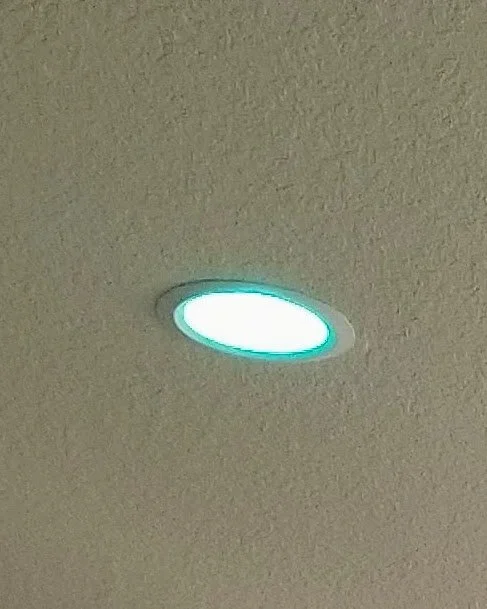 Recessed light with a teal glow
