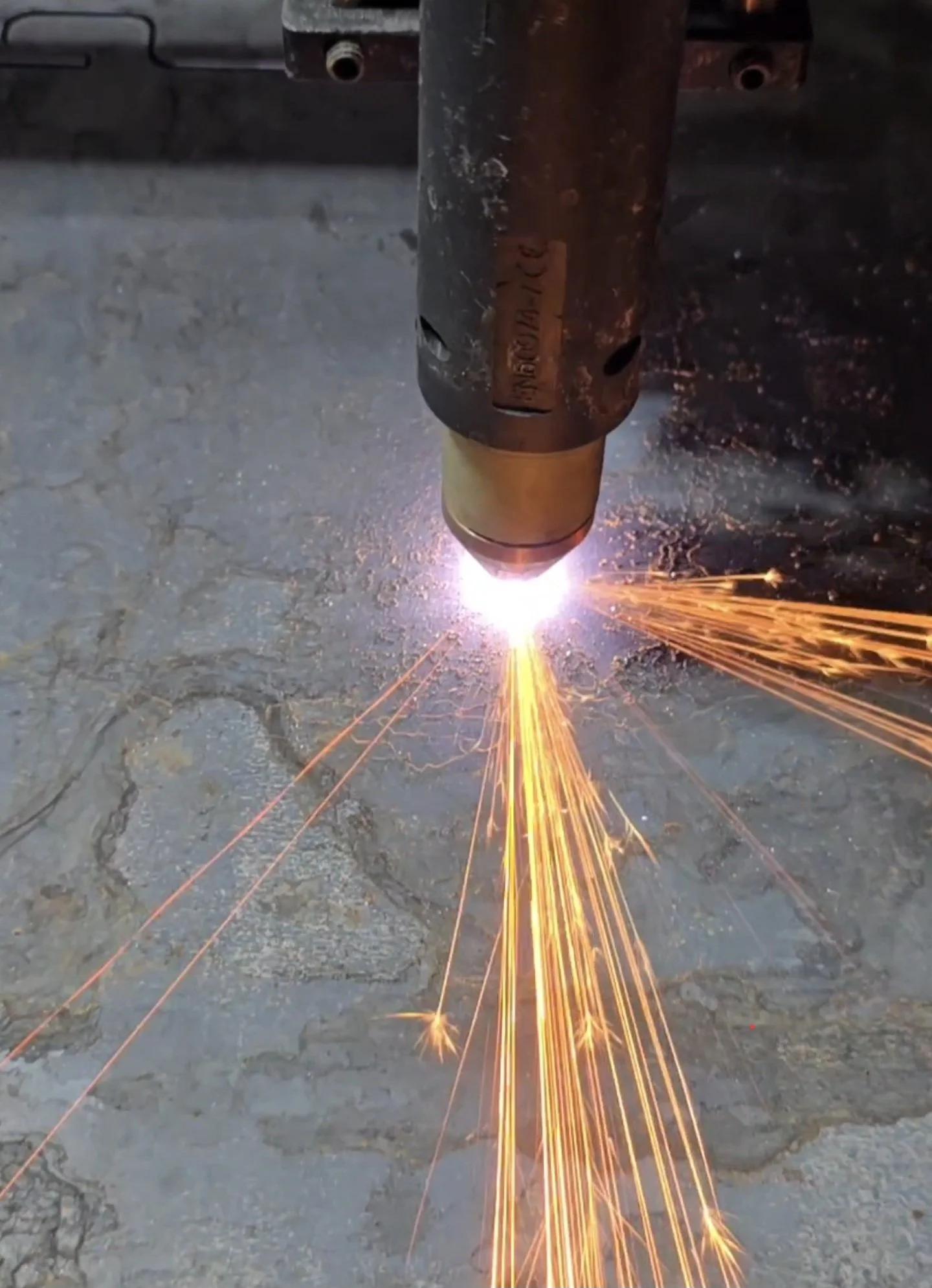 A welding process creating bright sparks on a metal surface.