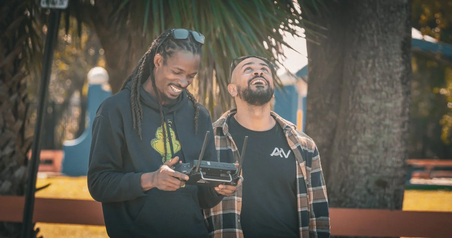 Kevin Padilla and a teammate outdoors with drone equipment