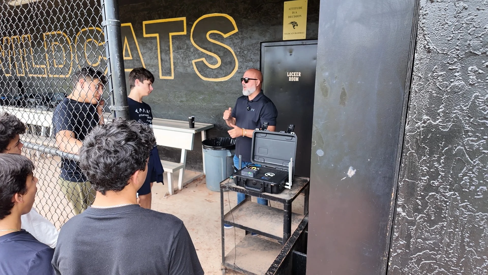 Lazaro Guzman demonstrating the WarDragon drone detection system to JROTC cadets.
