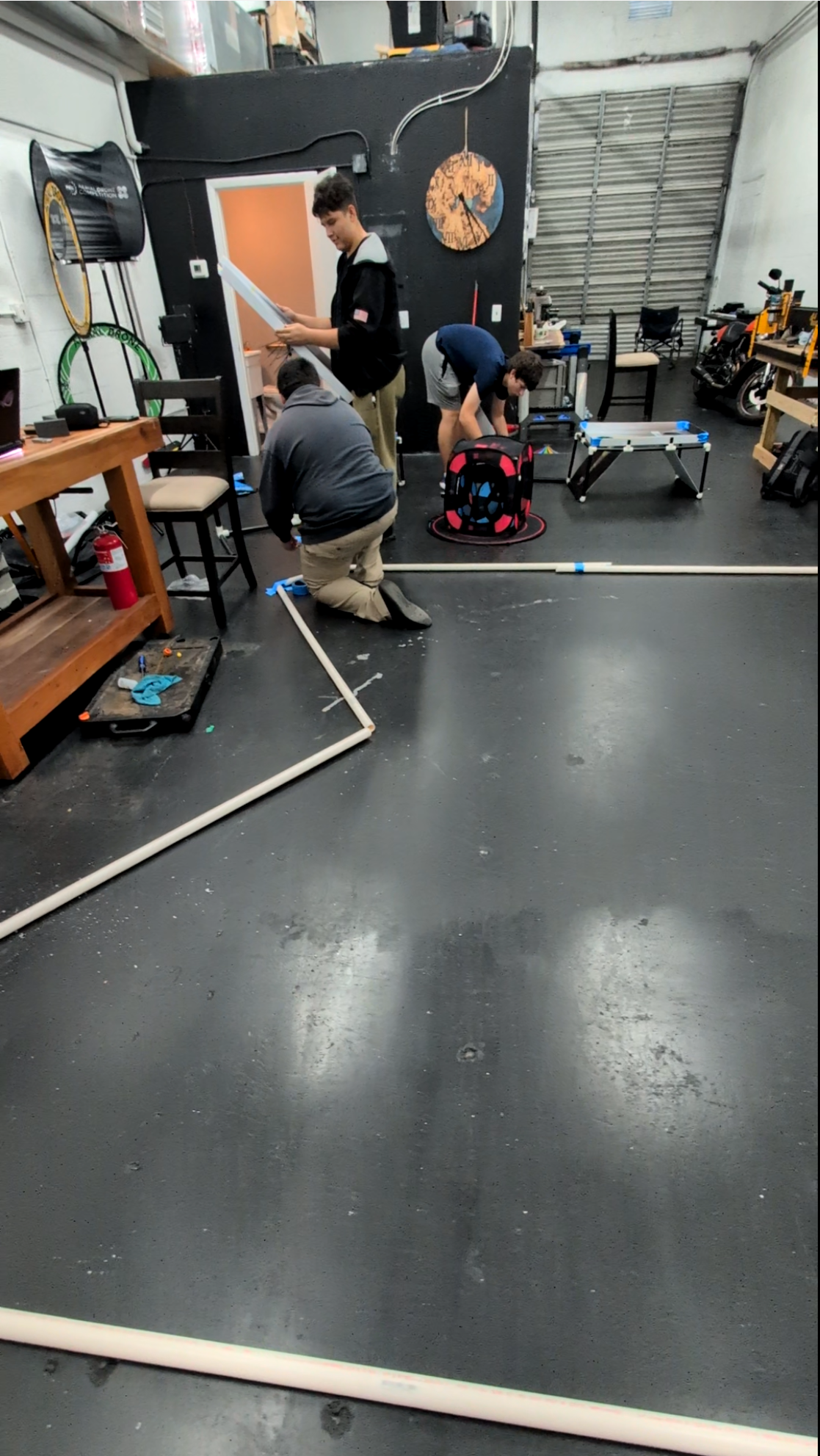 JROTC drone team cadets constructing a flight obstacle course during summer training at AeroVis headquarters