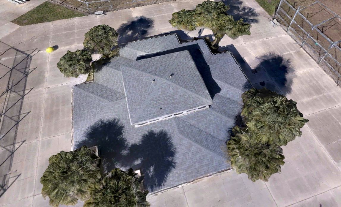 Drone view of a large residential shingle roof with multiple roof planes for roofing inspection and measurement