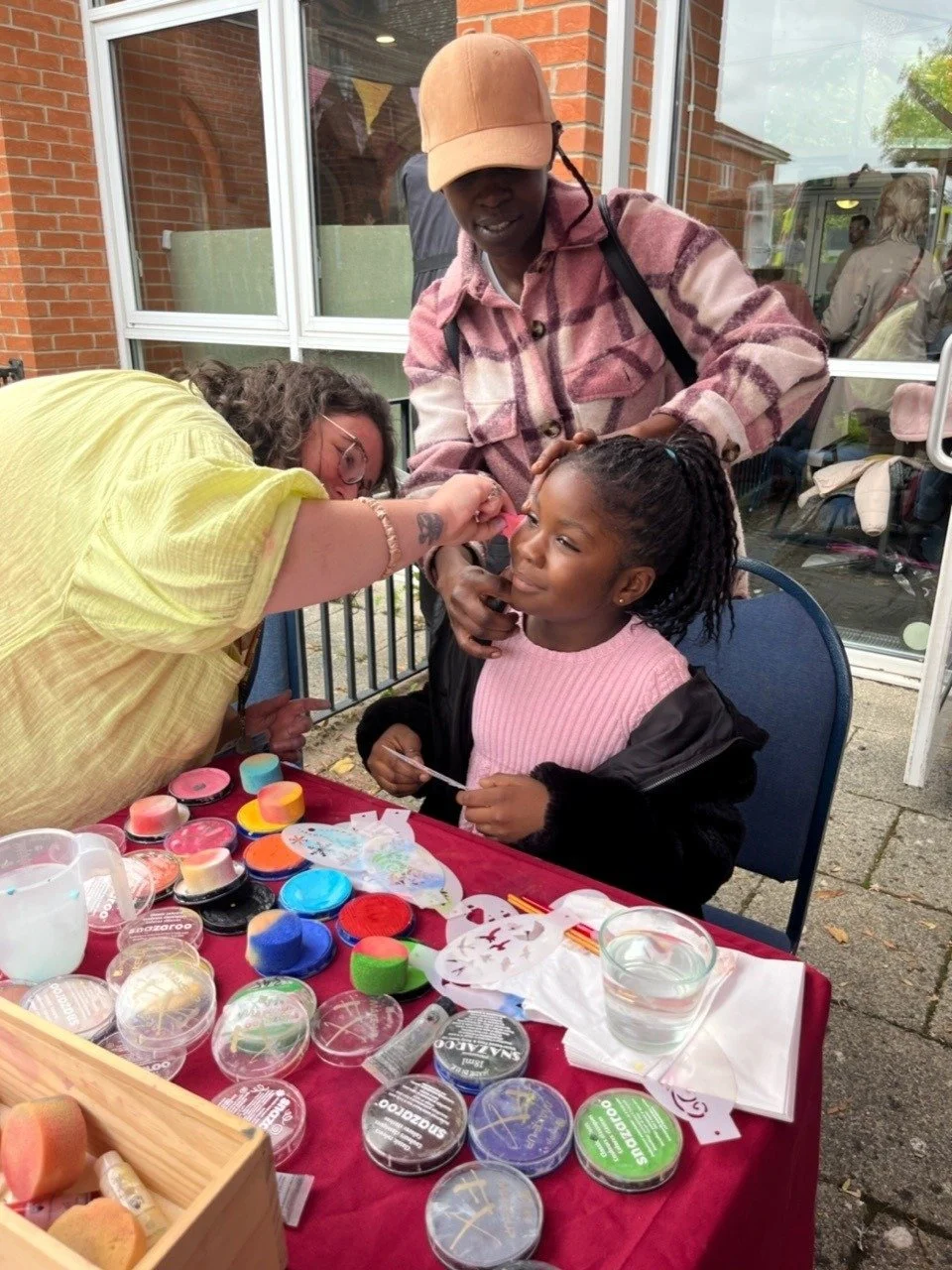 Outer Avenue kids have their face painted by Ilona from SUSU