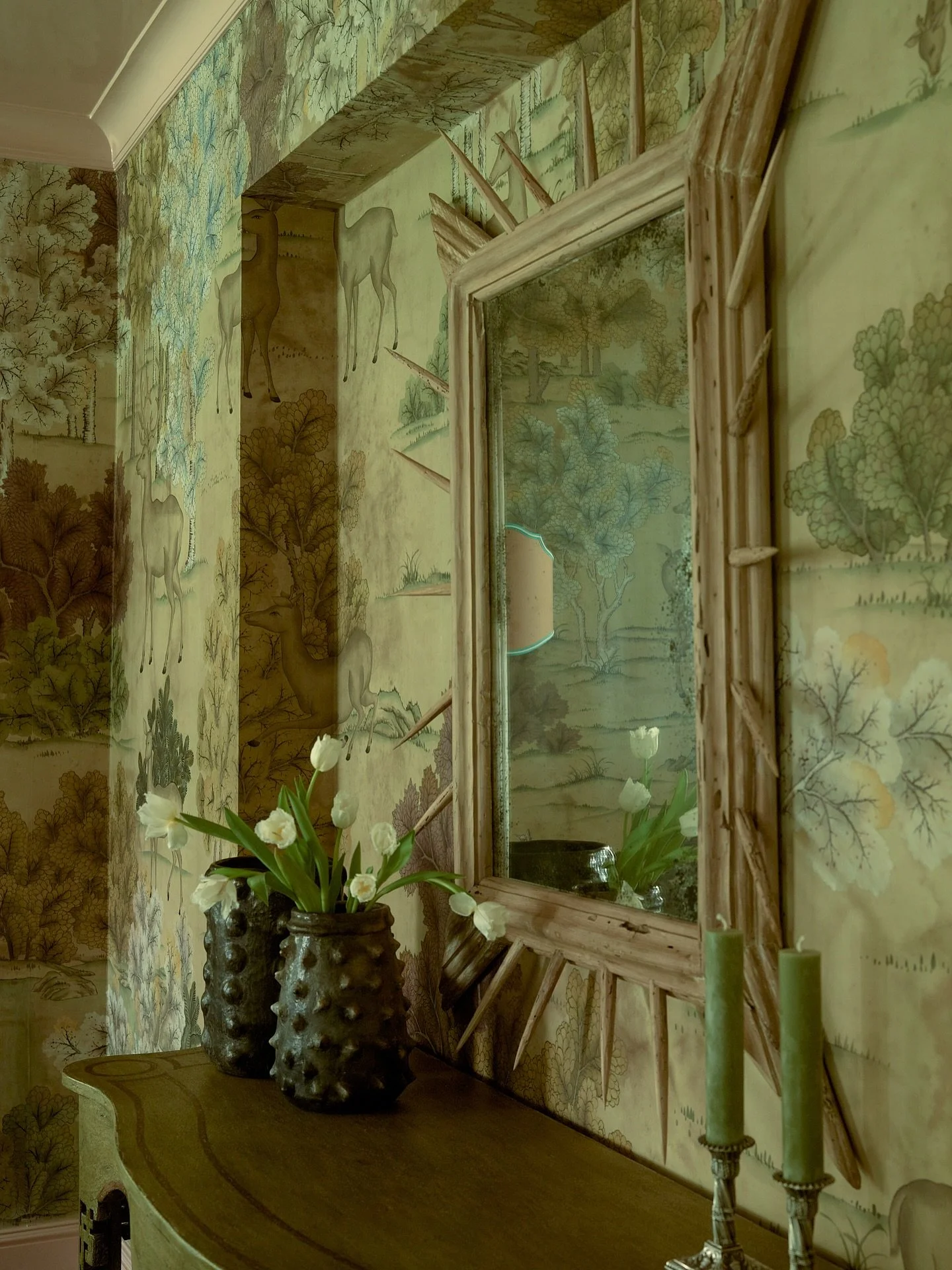 Visually anchoring this dining room is the Cheran spiked mirror by Studio Mike Diaz &mdash; hand-carved from 200 year old Yarin pine and finished in beeswax. 

A go-to artisan for Sees Design, we return to Studio Mike Diaz again and again for objects