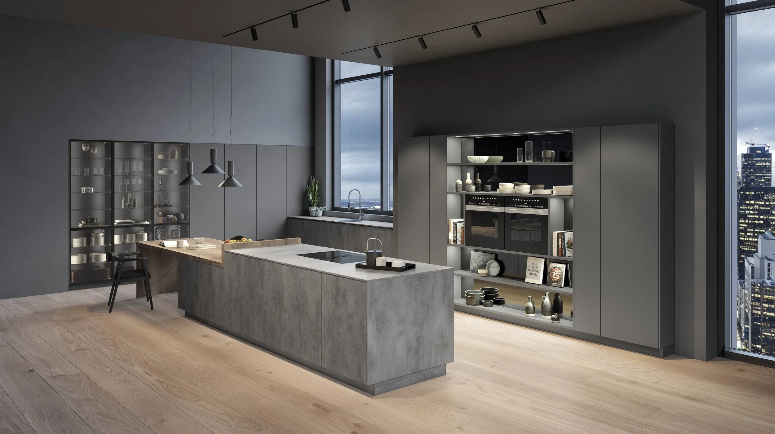 Modern köksinredning med grå skåp, köksö i betong, öppen hylla med kokböcker, stort fönster med utsikt över stadens skyline.