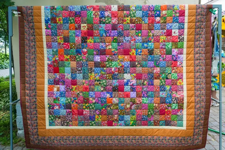 beautiful-bright-patchwork-beautiful-bright-patchwork-quilt-consisting-large-number-small-squares-121968577.webp