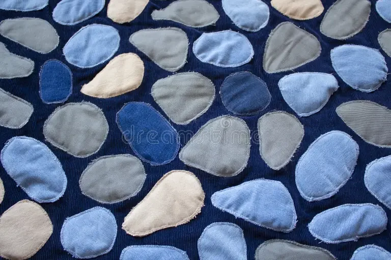 denim-background-patchwork-texture-imitation-sea-pebbles-fabric-pattern-new-life-old-jeans-recycling-clothes-template-rug-269130466.webp