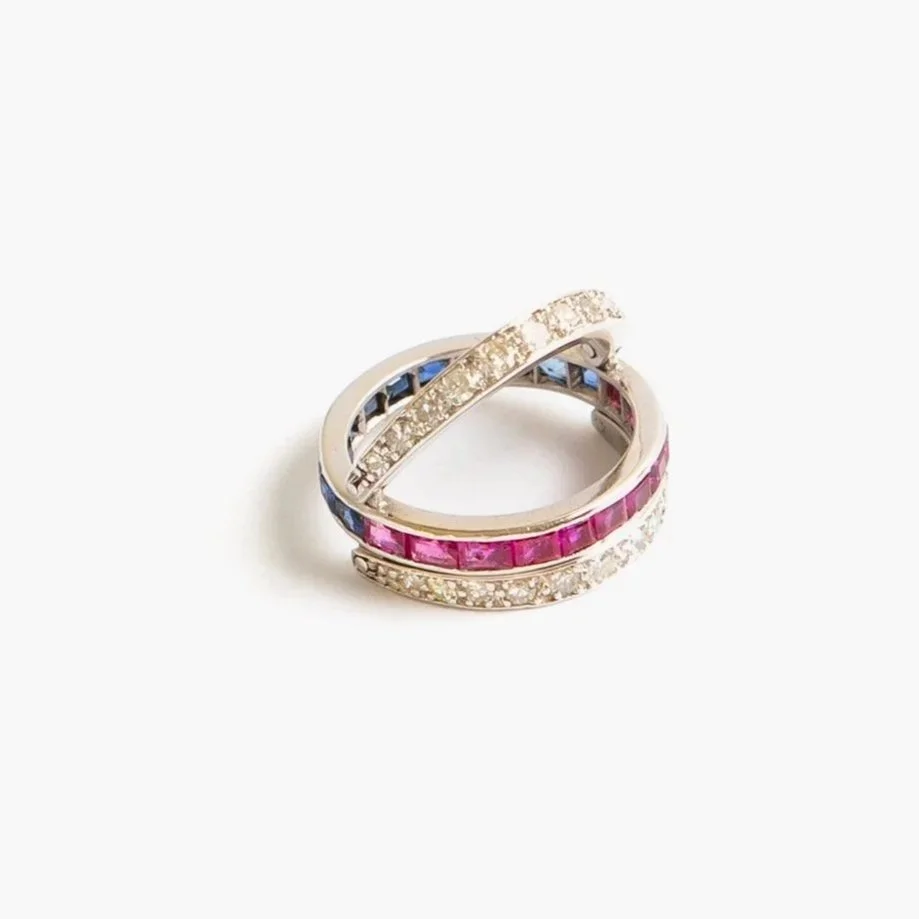 Late Deco swivel ring in platinum with channel-set sapphires, rubies, and old-cut diamonds, also known as a Night & Day ring, size L 1/2.