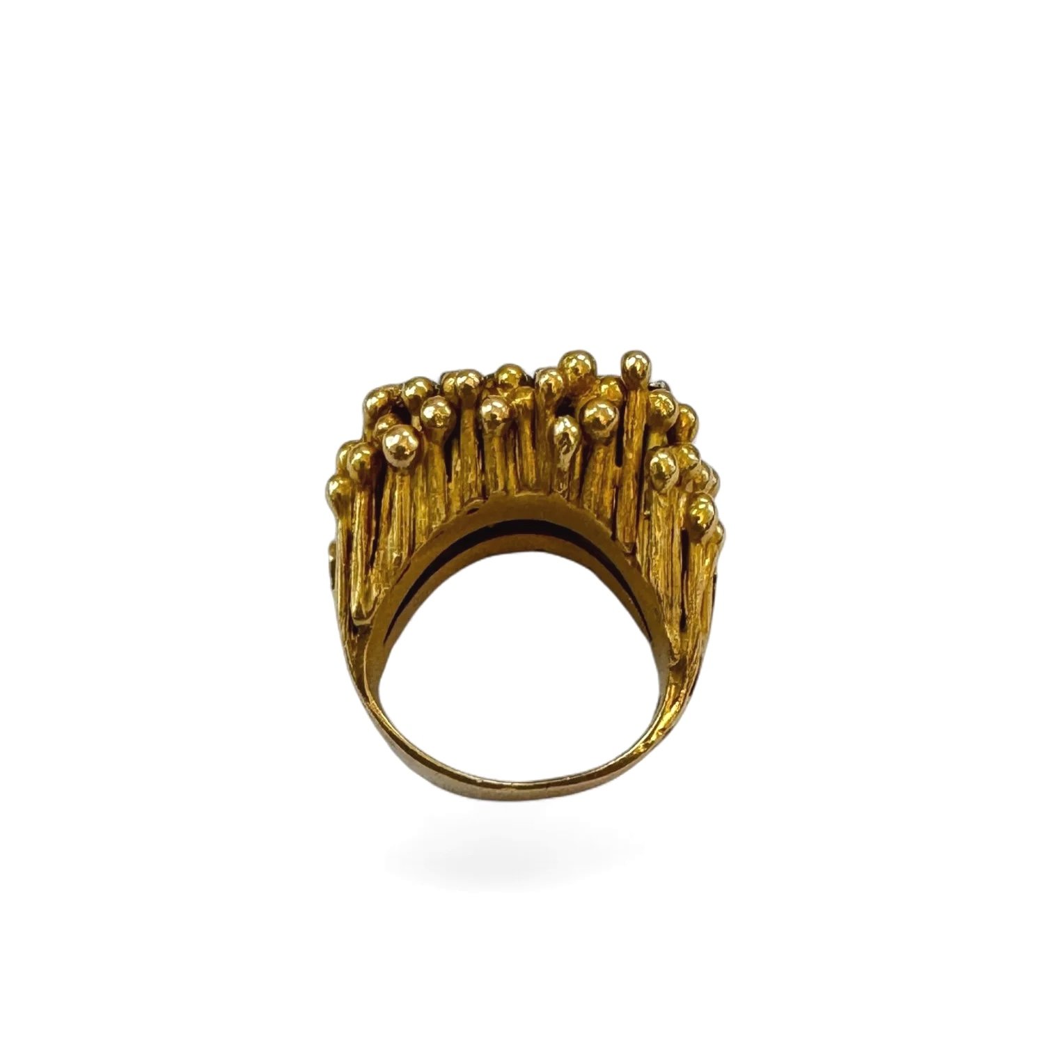 Vintage brutalist diamond ring in textured 18K gold with baguette diamond cluster