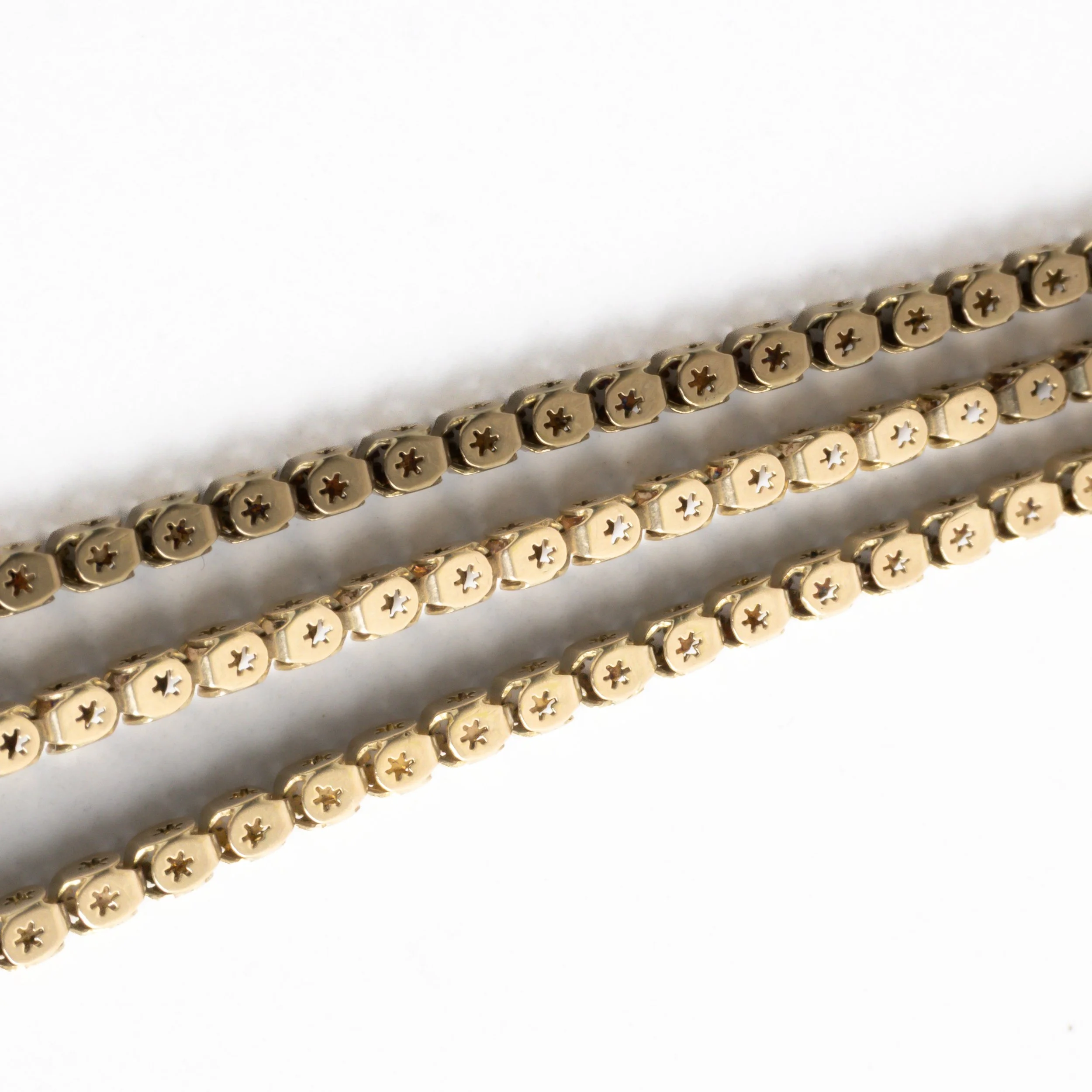 Close-up detail of vintage graduated box-link necklace showing articulated textured links