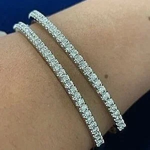 Carrie Diamond Tennis Bangle in solid 9ct white gold with 1ct of brilliant-cut lab-grown diamonds, showcasing a sleek hinged design from The Signature Edit by Signature Vintage.