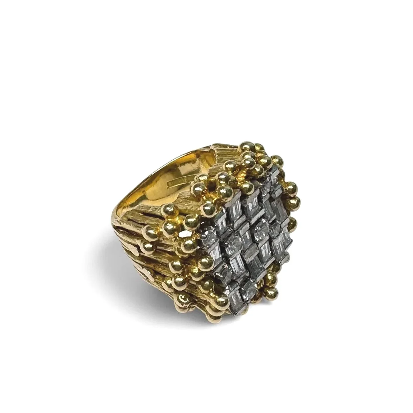 Vintage brutalist diamond ring in textured 18K gold with baguette diamond cluster