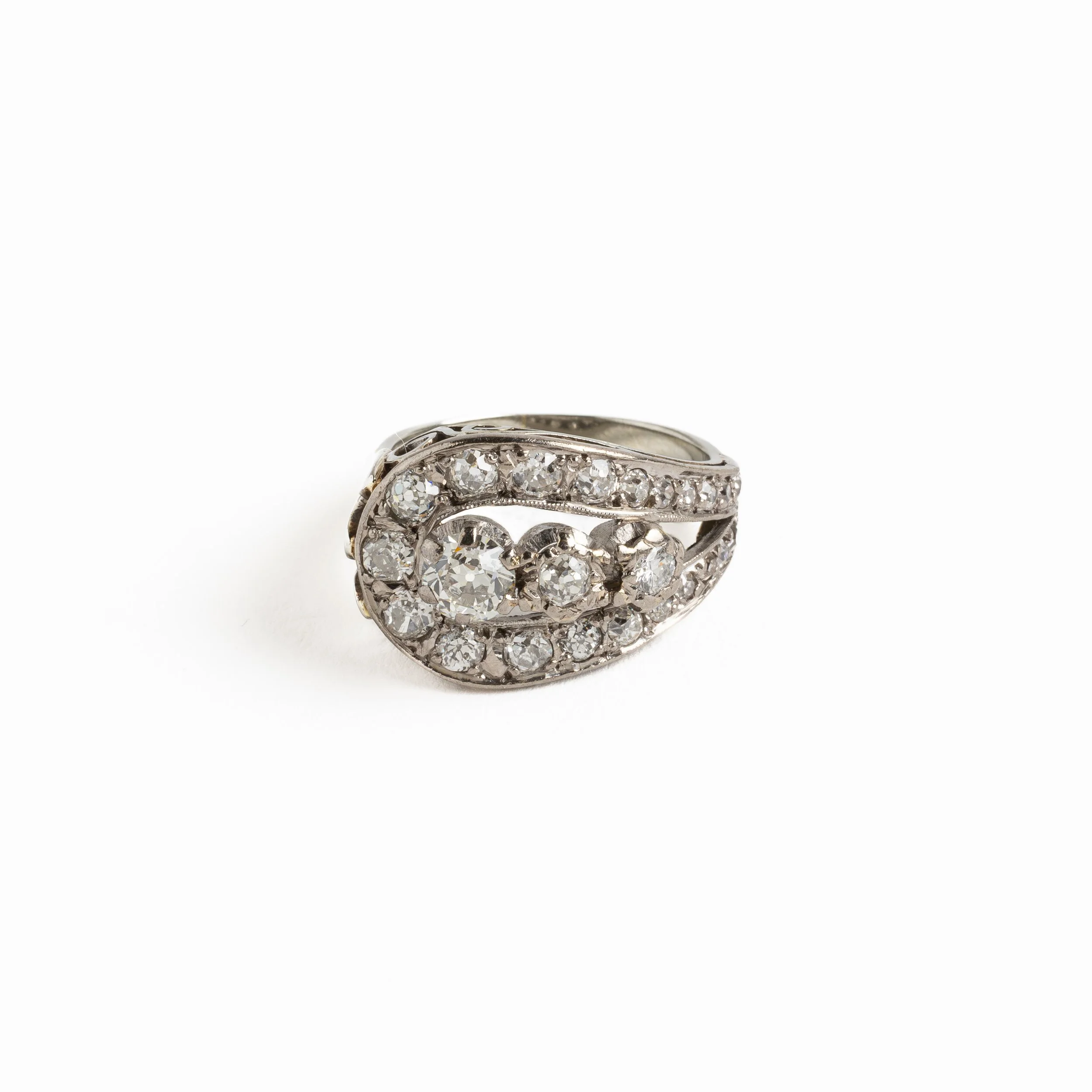 Vintage 18ct white gold diamond cluster ring with approx. 1.9ct of brilliant and transitional-cut diamonds in a curved Art Deco–influenced design, photographed on a light background.