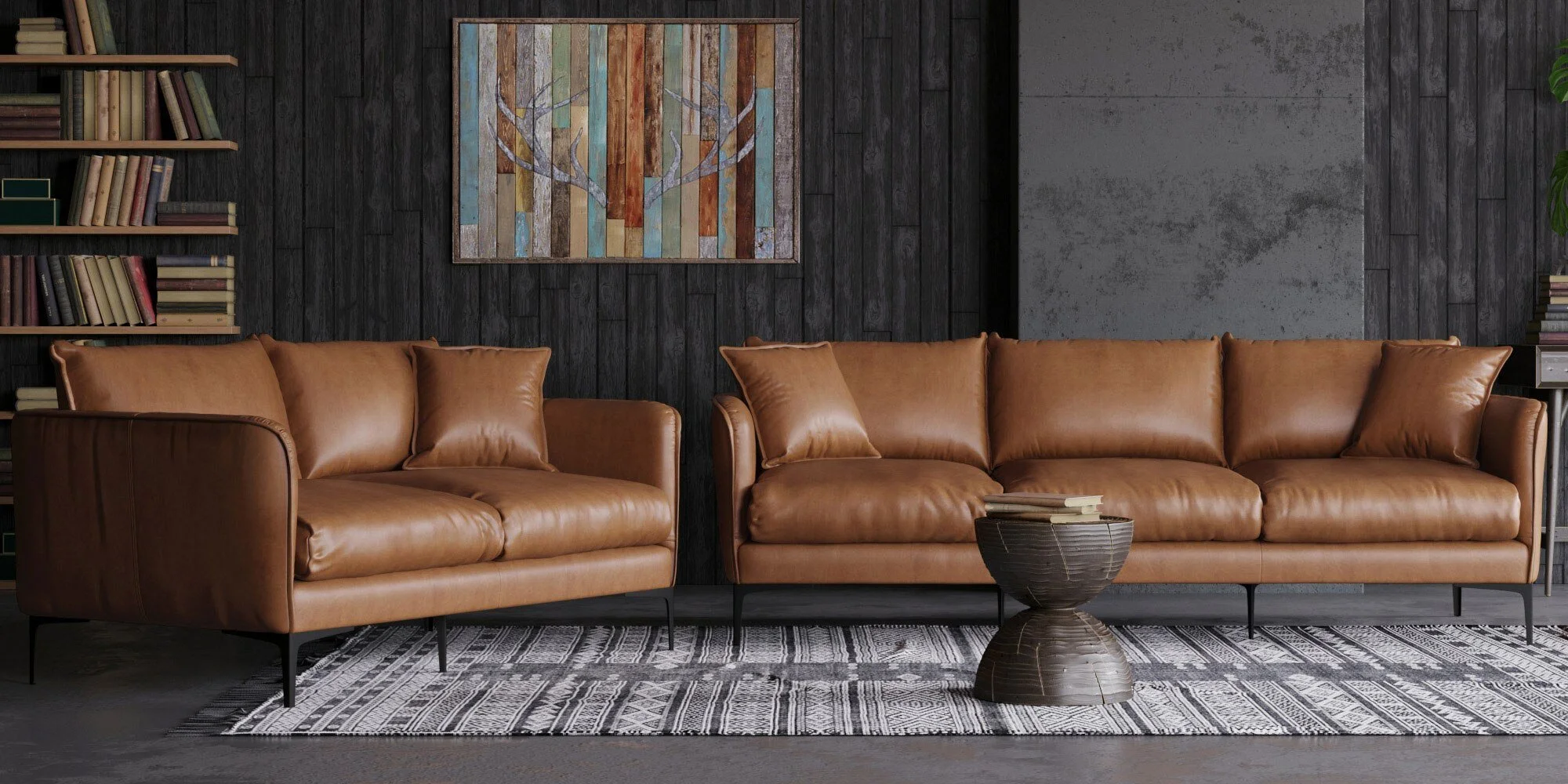 Two brown leather sofas in a modern living room with black wall paneling, a colorful wooden tree art piece, a black patterned rug, a round black side table with books, and bookshelves with books and plants.