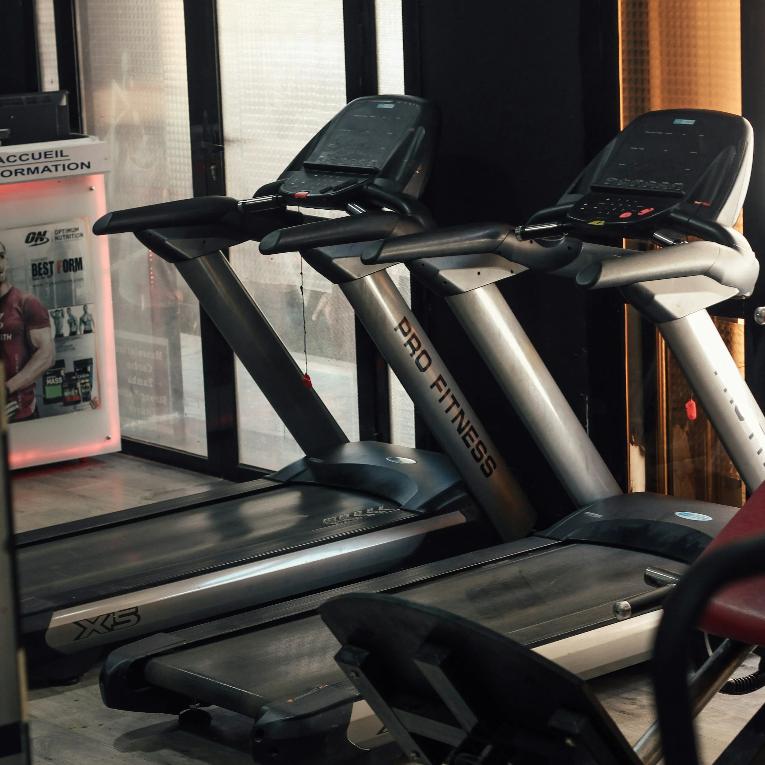 Modern treadmill set up in a clean home gym for indoor cardio workouts.