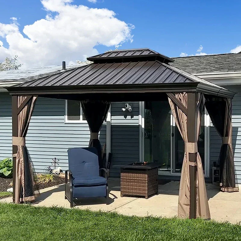 A screened gazebo with curtains on a concrete patio in the backyard of a house with blue siding, a window, and a sliding door.